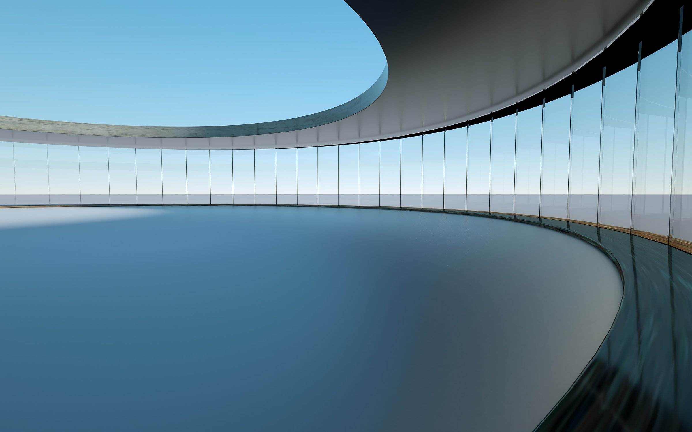 A modern and spacious curved room features floor-to-ceiling glass windows that offer a clear view of the blue sky outside. The interior is minimalist with clean lines, smooth surfaces, and a sleek, contemporary design. The curved ceiling and walls create a sense of openness and flow, while the large glass panes allow abundant natural light to fill the space, casting soft shadows on the empty, blue floor. There are no people present, enhancing the serene and quiet atmosphere of this architectural masterpiece, which blends functionality with aesthetic appeal through its geometric symmetry and balanced proportions.