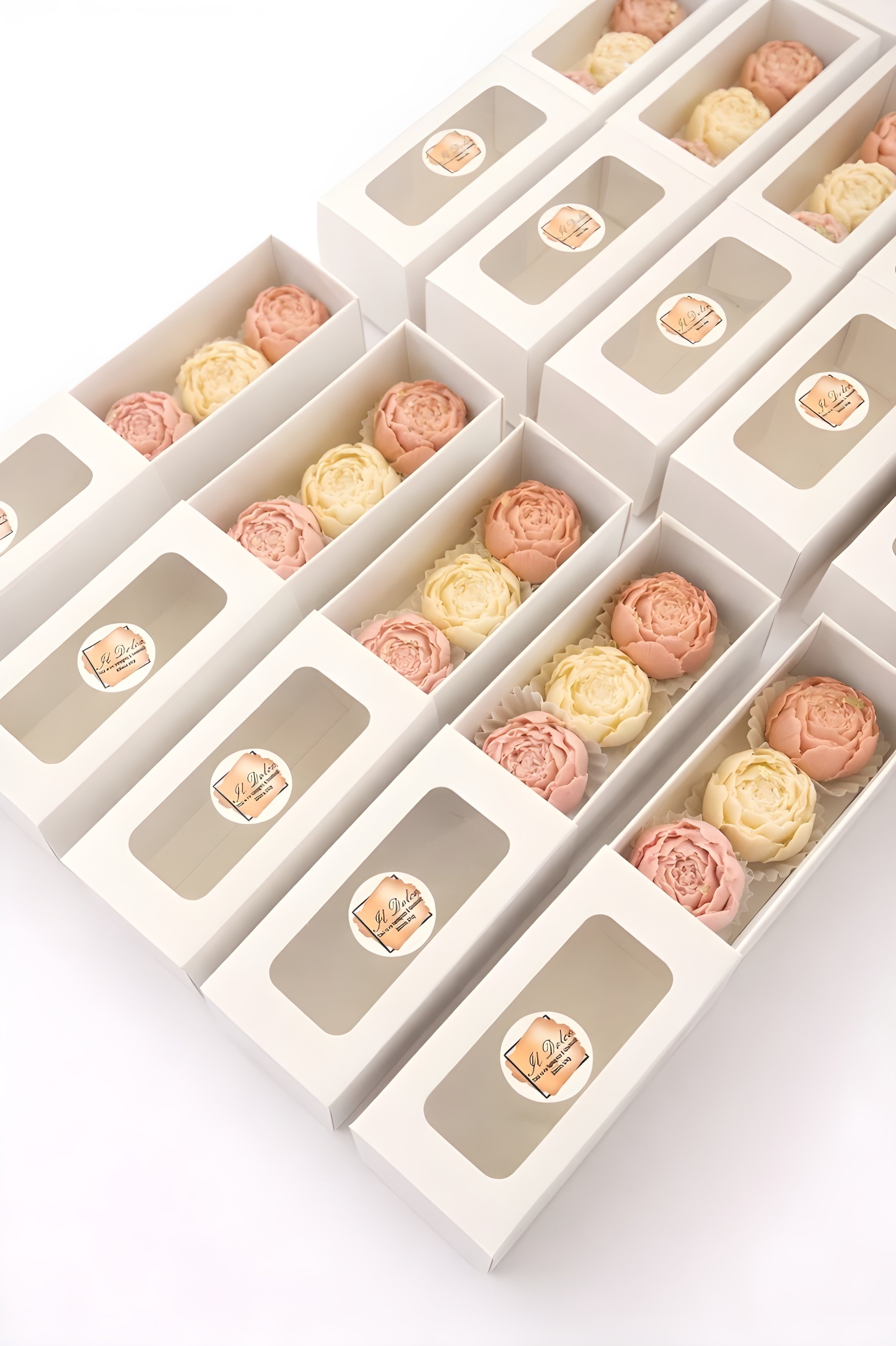 Assortment of chocolate pralines in a shop window at night
