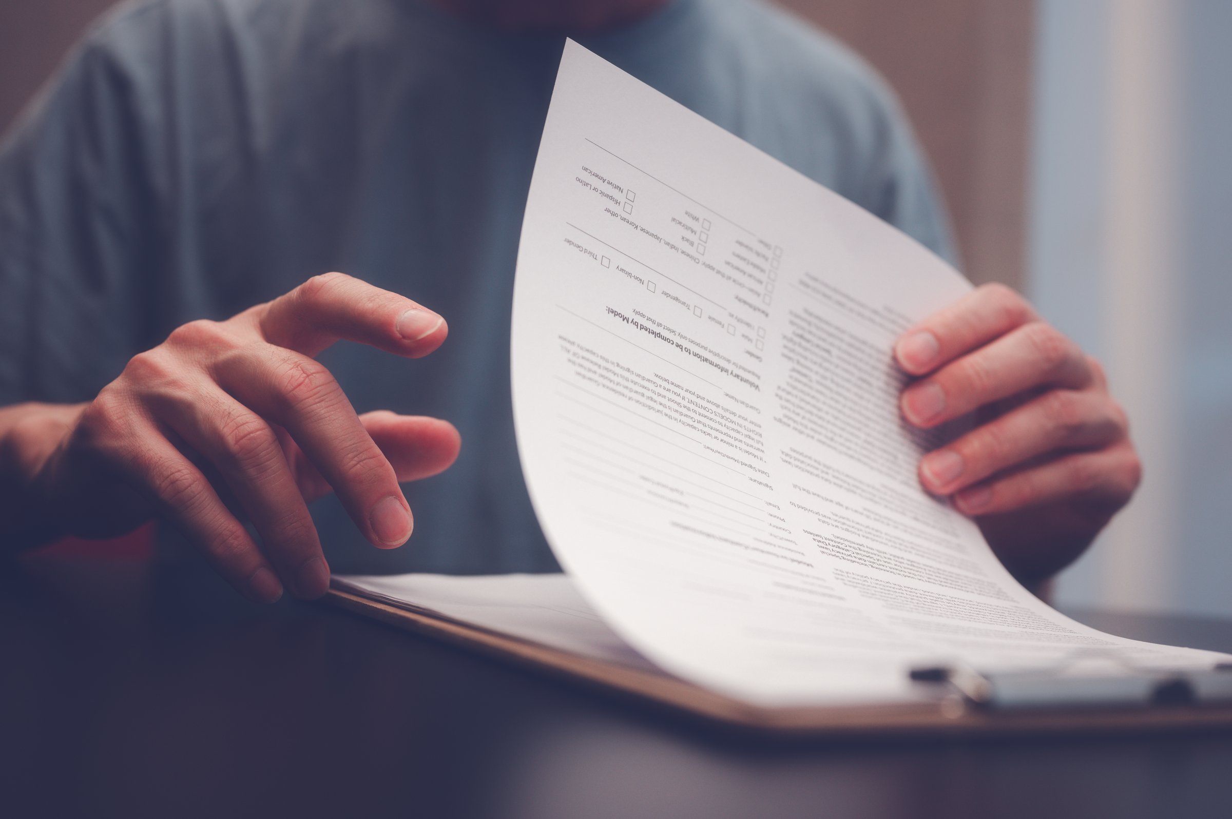 Document and data analysis concept, man hand holding or handing over document paperwork on clipboard, documentation, document data management system