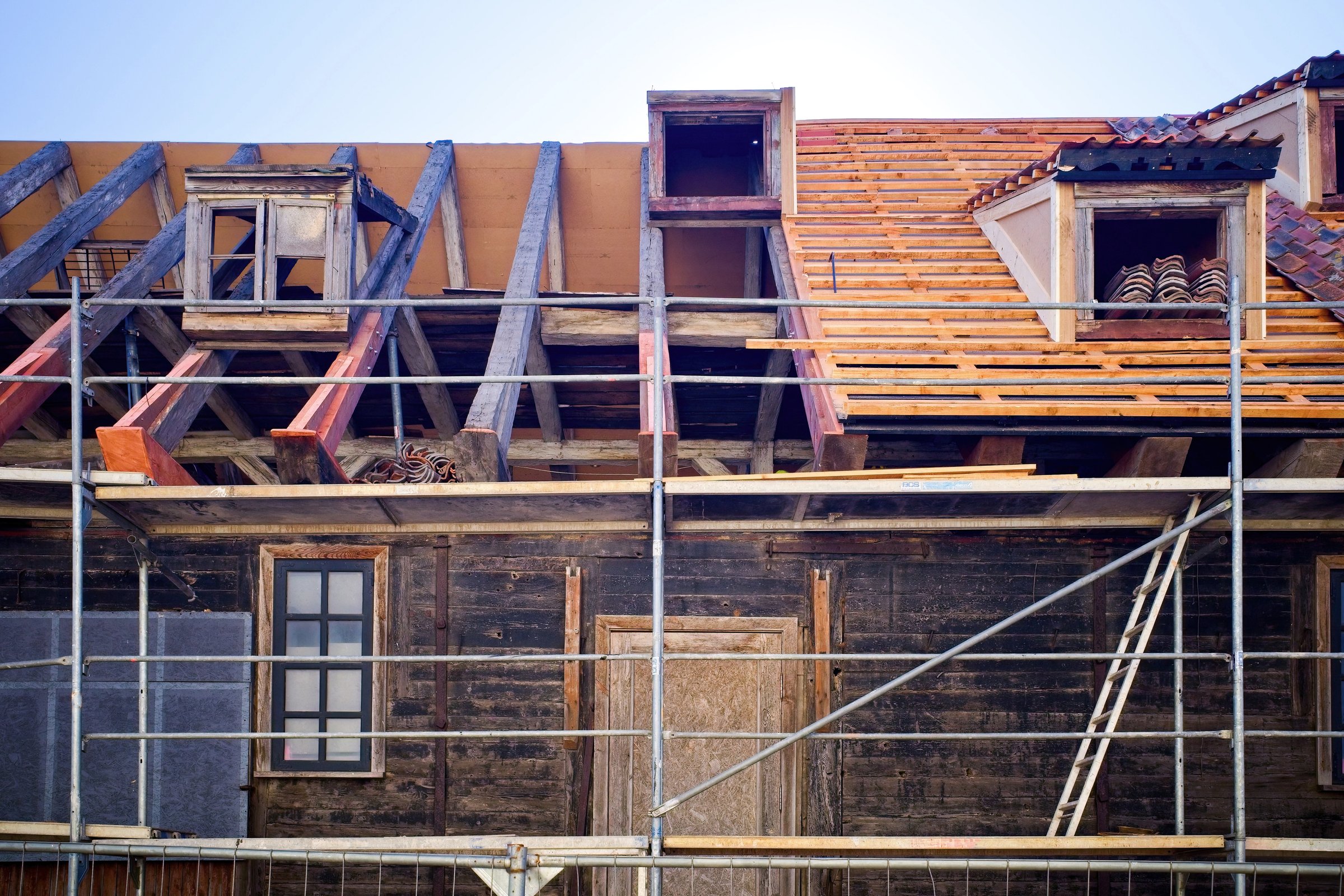 Renovation of an old wooden barn. Wooden beams. Selective focus.