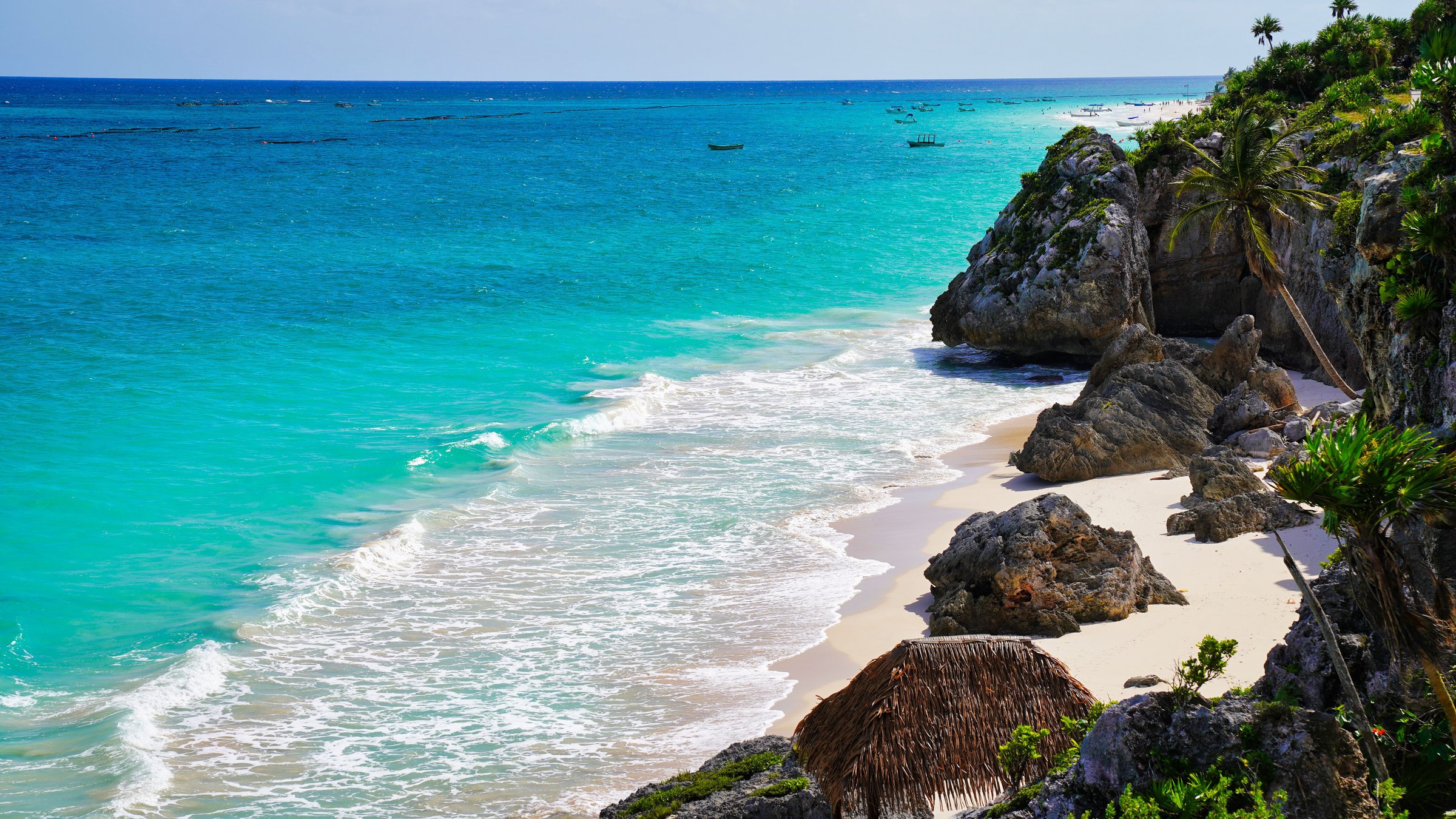 A secluded sandy cove,known as the Beach of the Ruins,Playa Ruinas on the brilliant blue green Caribbean sea at the  late 13th century Mayan ruins of Tulum,Mexico