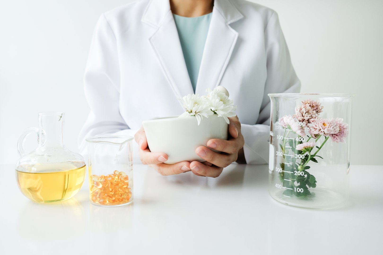 the scientist,dermatologist test cosmetic beauty skin care product.blank package bottle container natural cream,serum in laboratory.