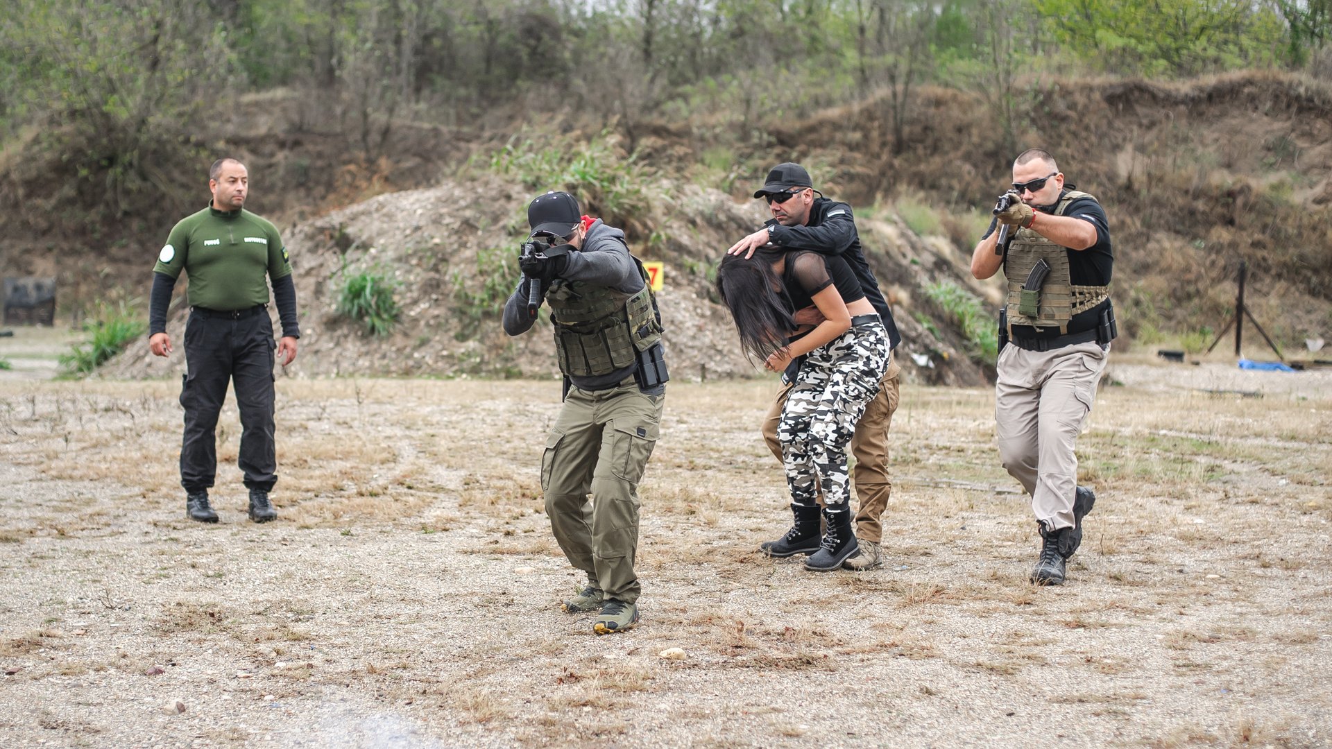 Bodyguard and VIP people security protection. Combat gun shooting training on outdoor shooting range