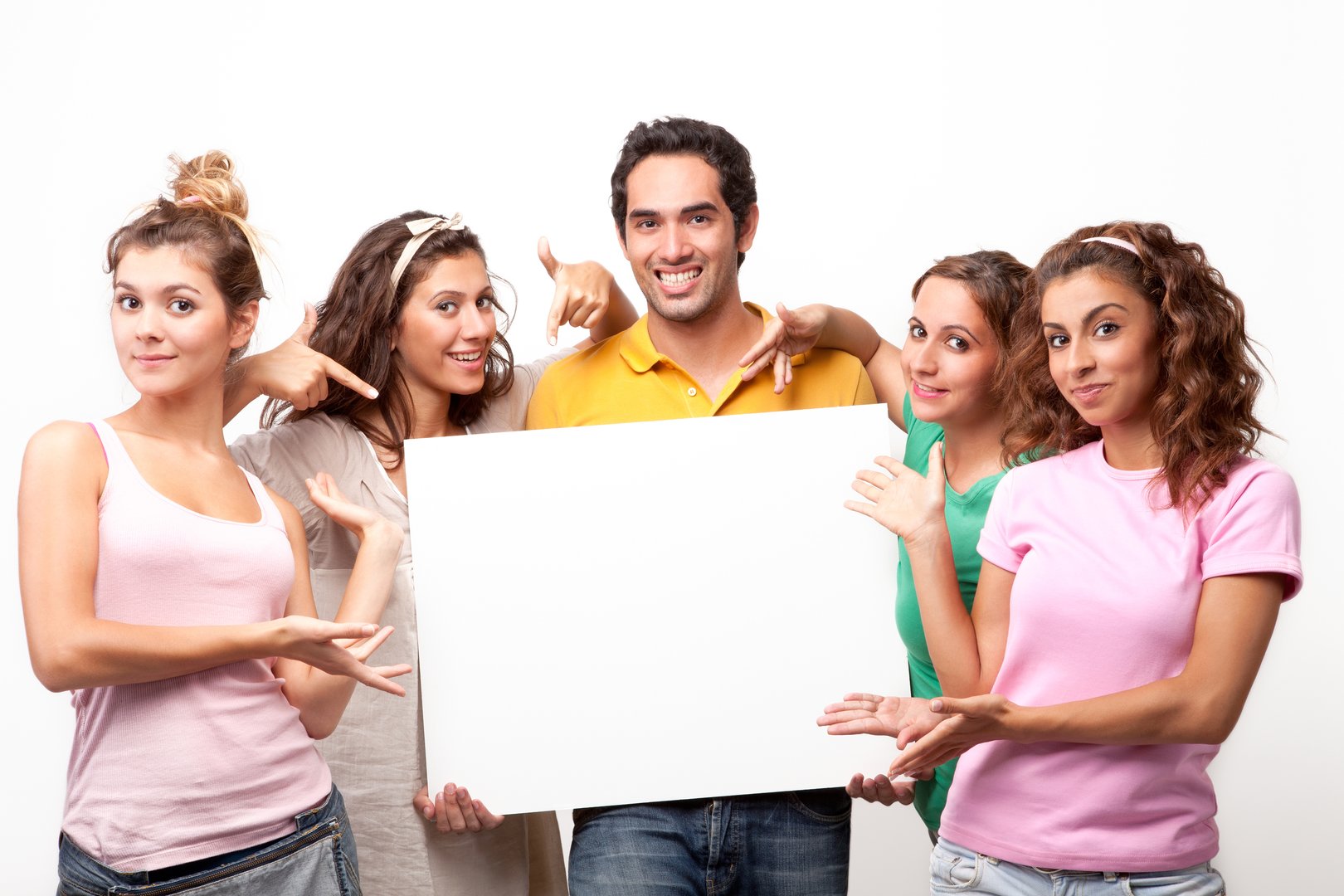 Group of young friends with a banner ad, studio shot