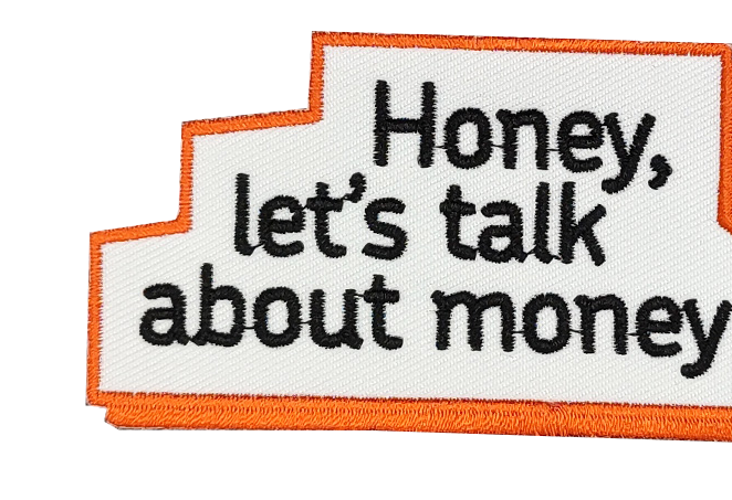 Patch with text Honey, lets talk about money in black embroidery on white with an orange border.