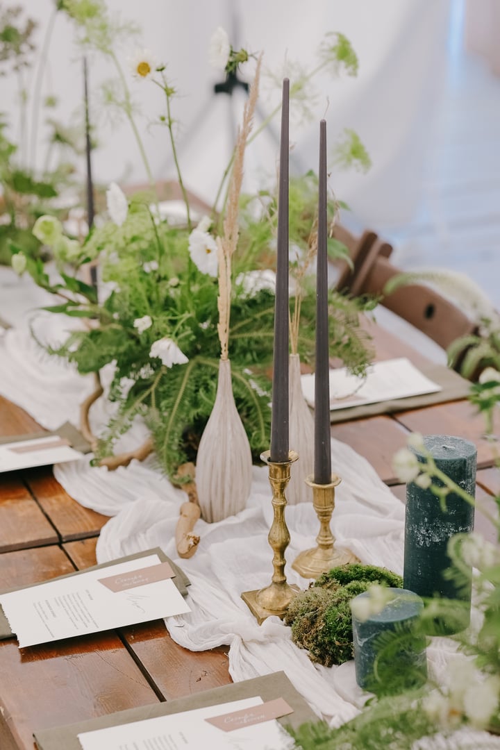 wedding decor decoration for a wedding ceremony or birthday. flowers and candles on festive boho tables. wedding in the forest in a beautiful tent, florists and decorators create a beautiful holiday atmosphere