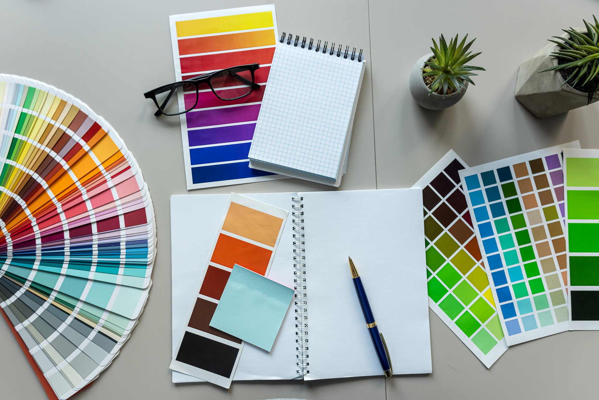 Modern office workplace multicolored paper samples brush notepad. Creative occupation