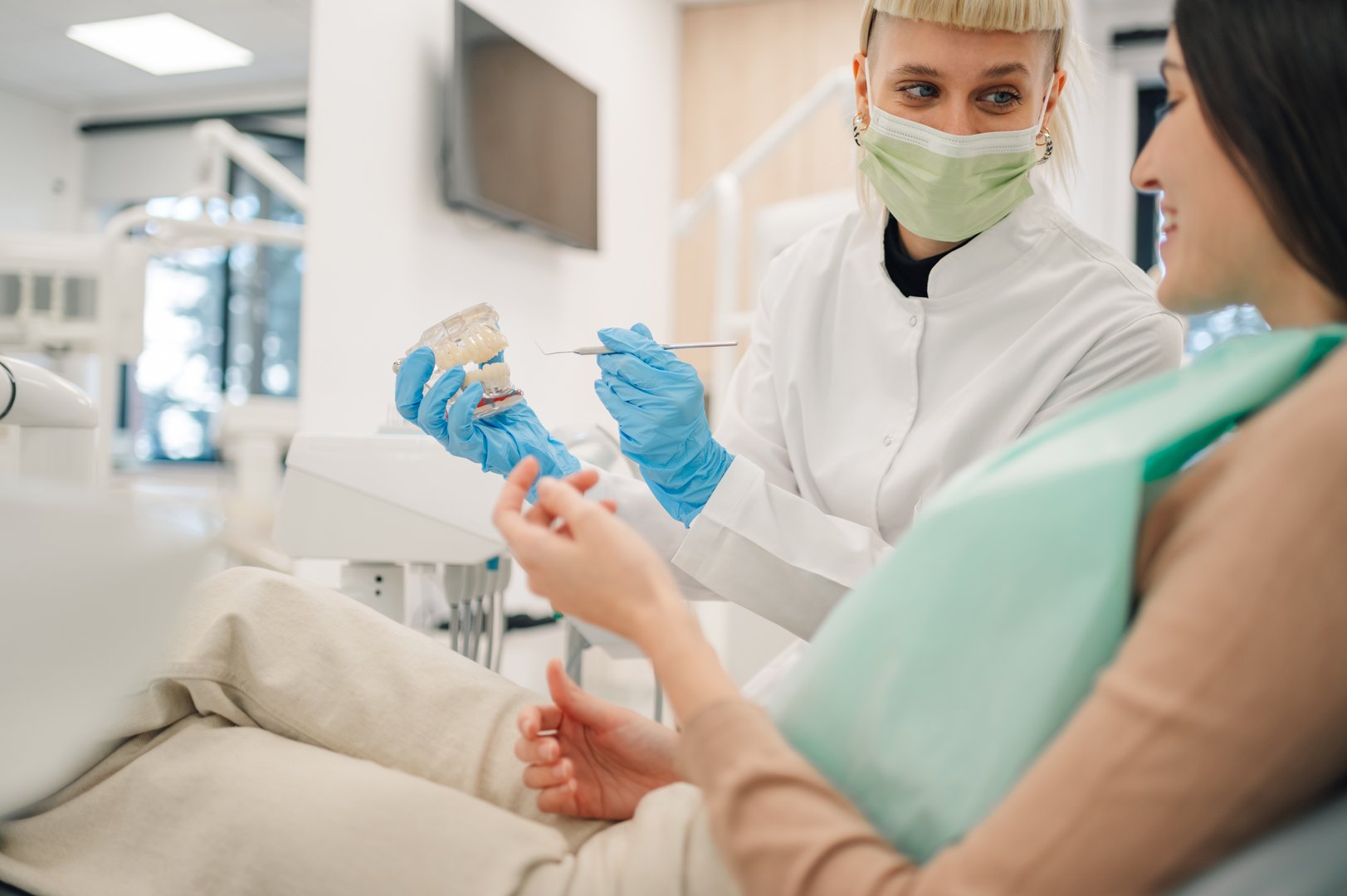 Dentist explaining dental treatment to patient