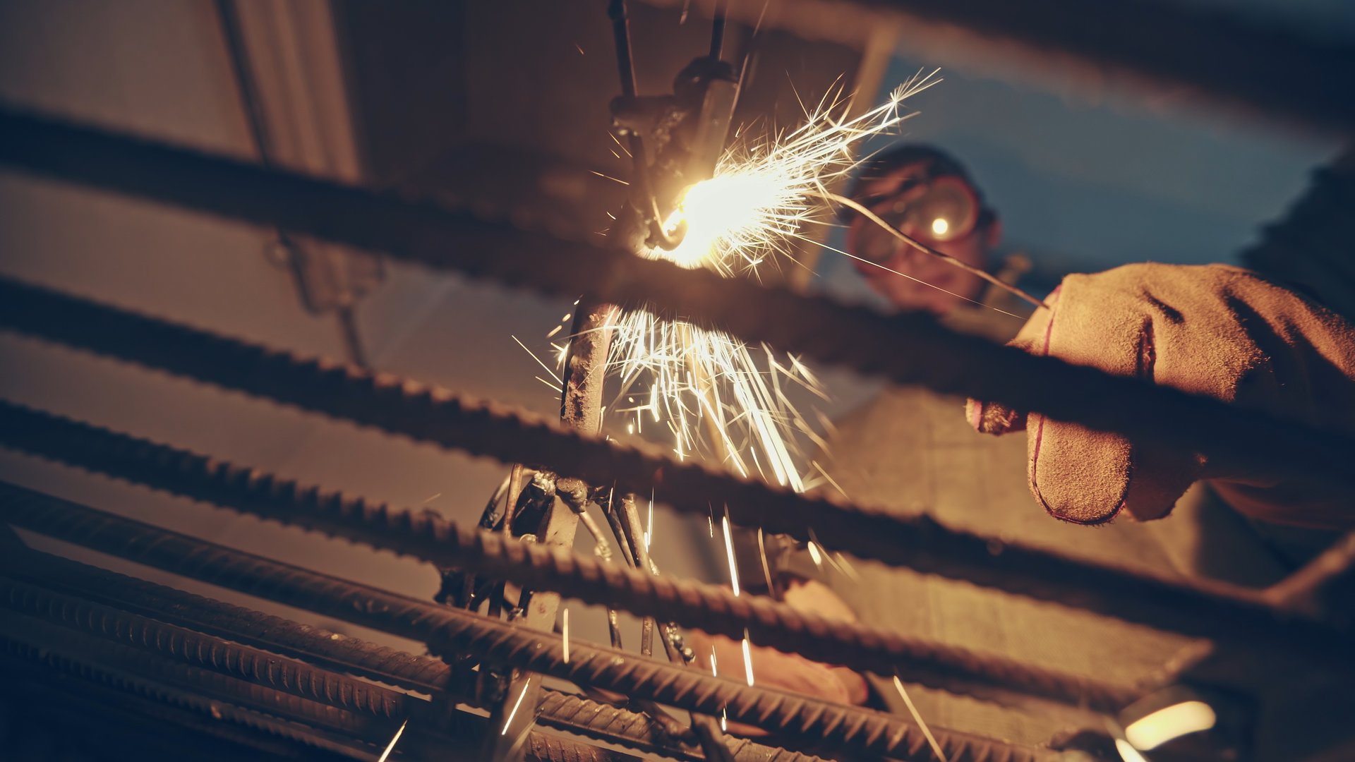 Colorful sparks flying from welding in workshop