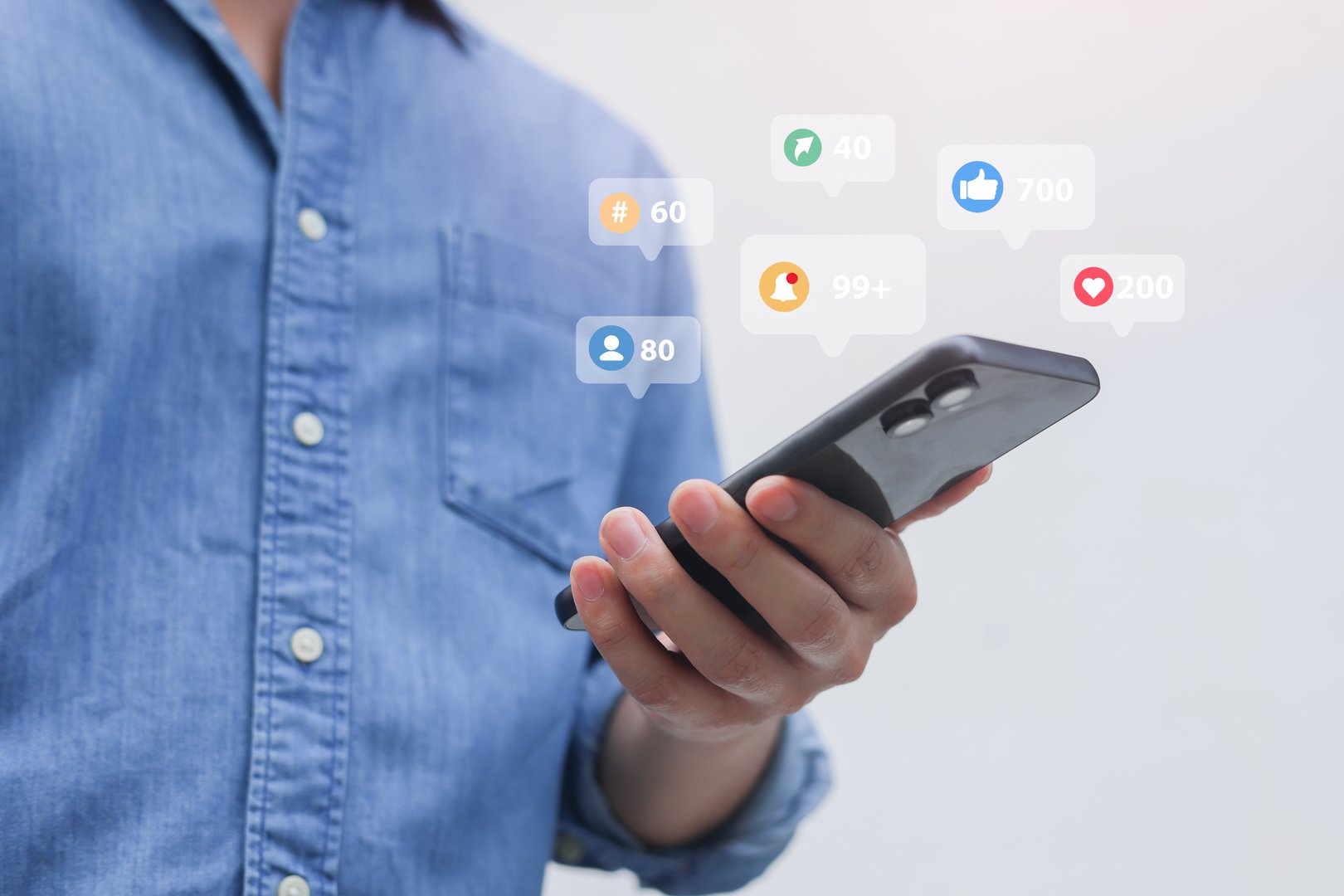 Business professional managing social media on smartphone