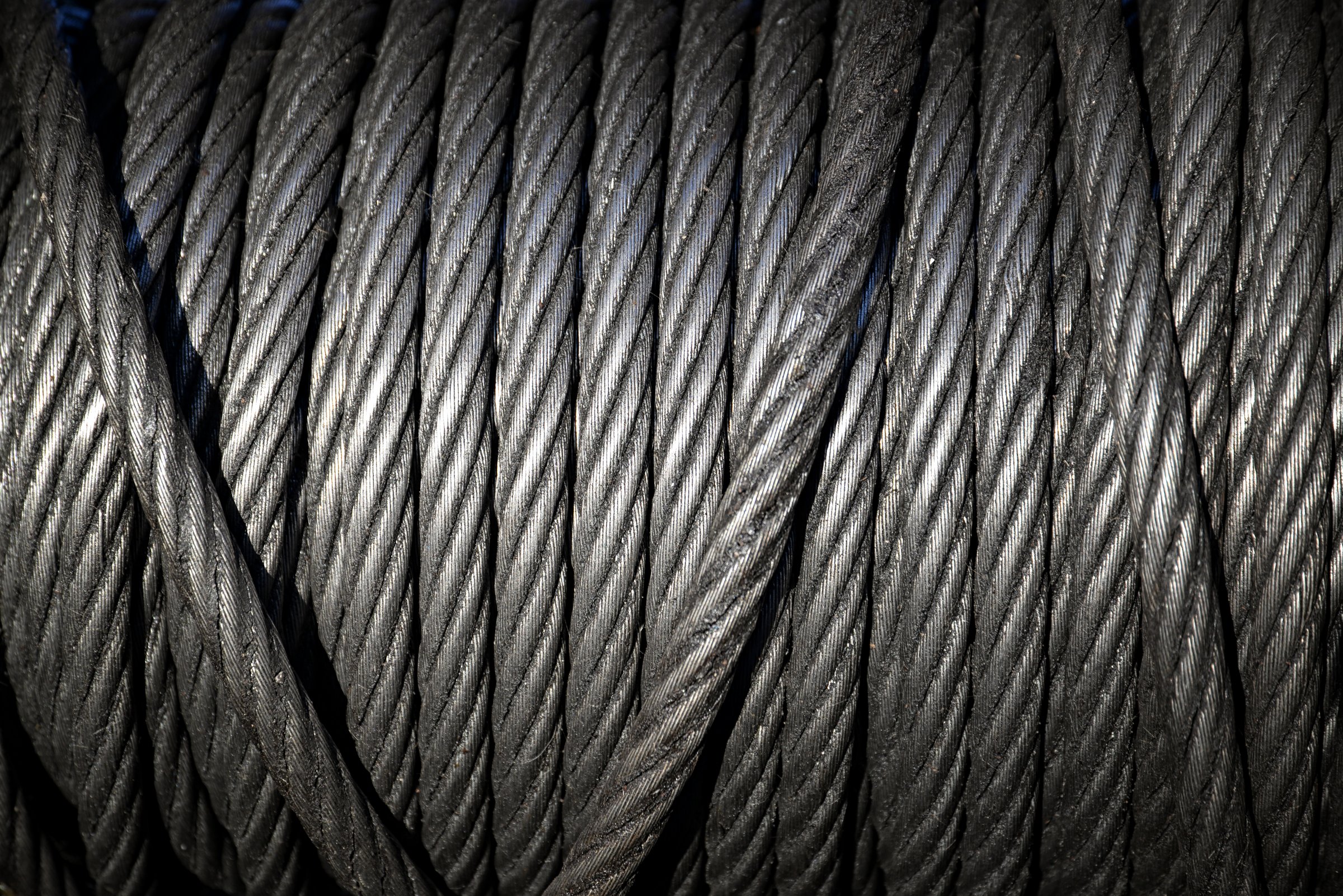 Background with a coiled steel cable.