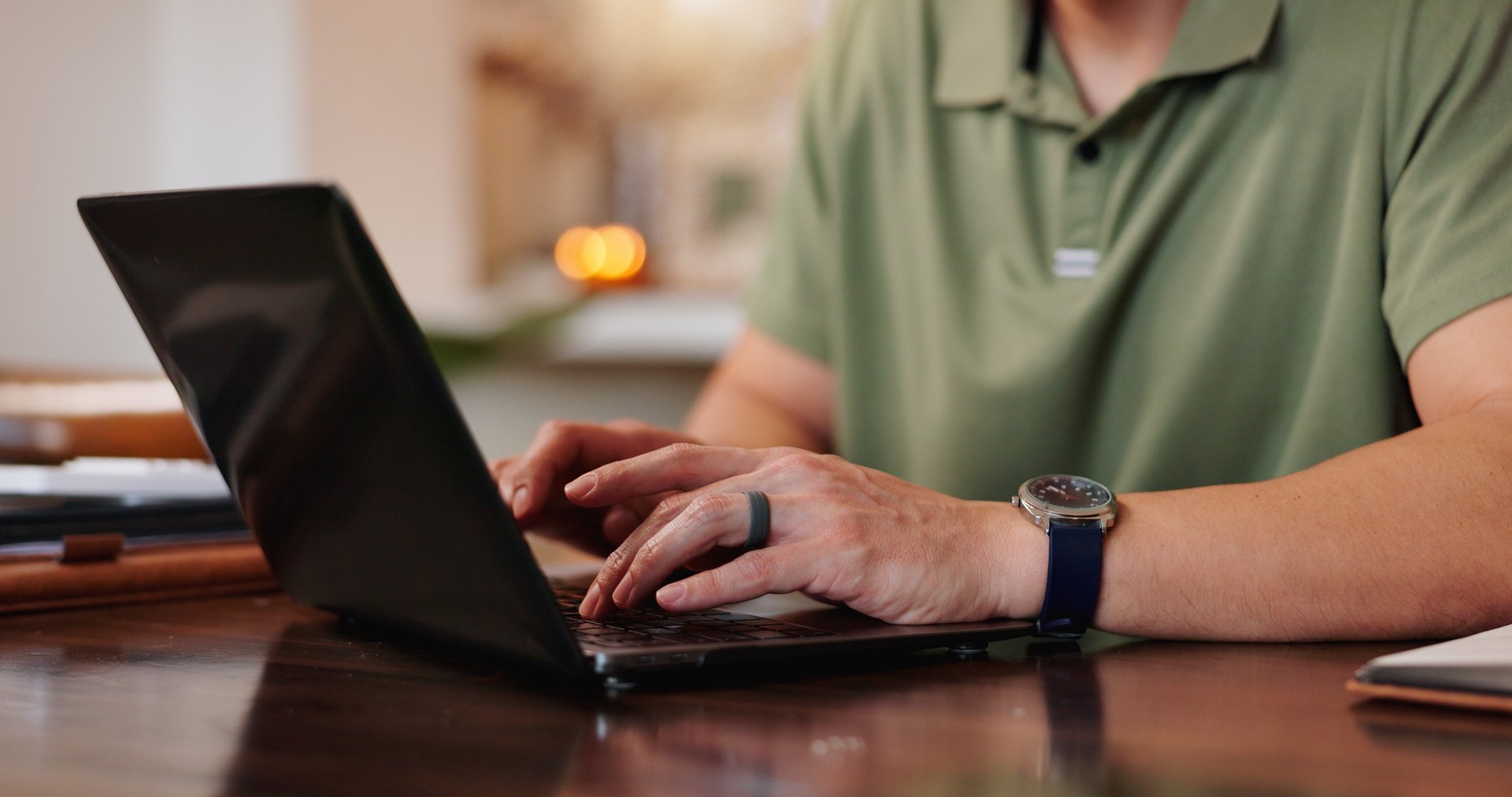 Typing, hands and laptop for remote work, home and freelancer with project, online and planning on desk. Keyboard, digital and person with tech, entrepreneur and resume writer in house and editing