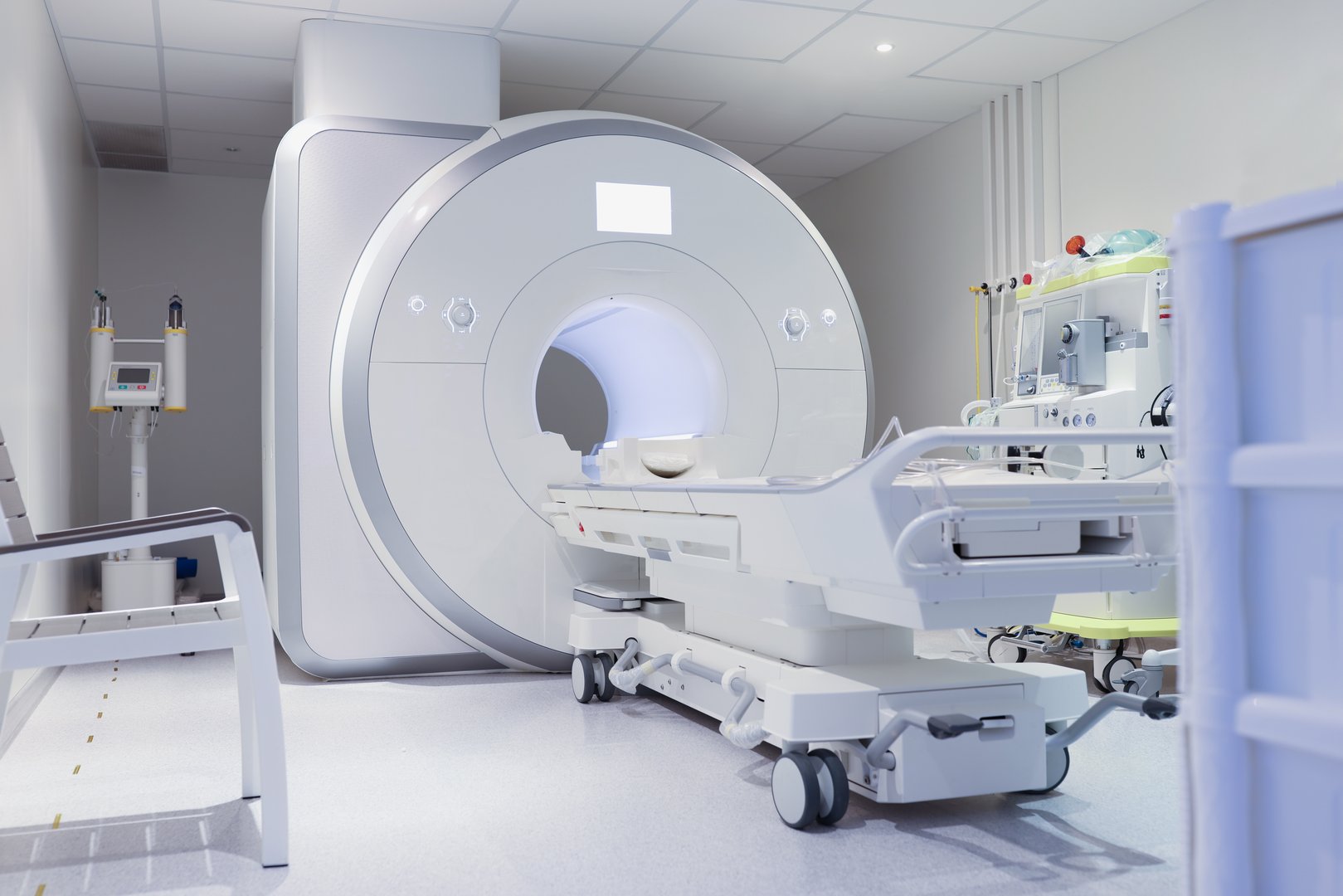 Nuclear magnetic resonance imaging laboratory with high technology contemporary equipment. White sterile MRI room concept