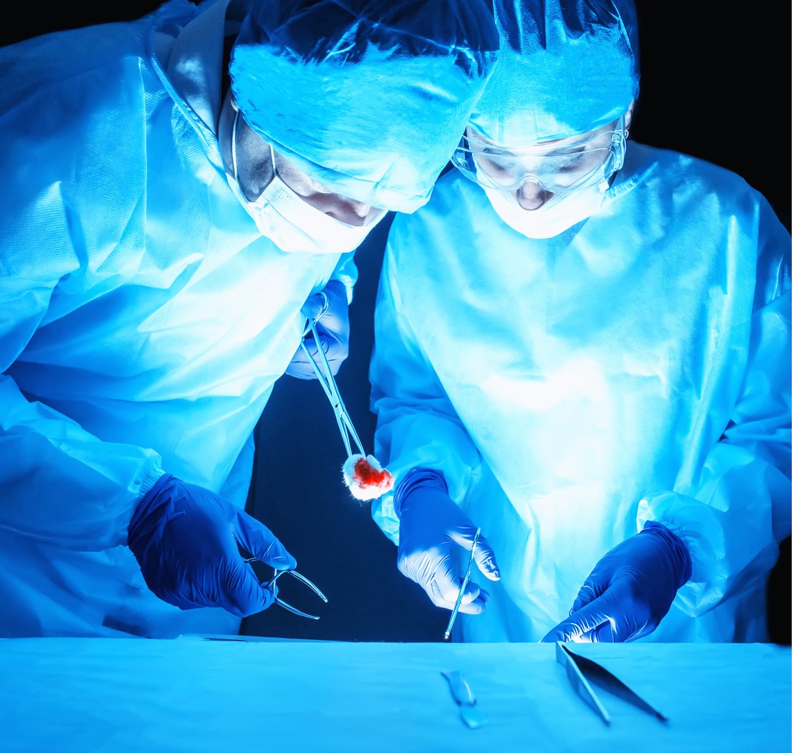 Two surgeons perform a complex operation