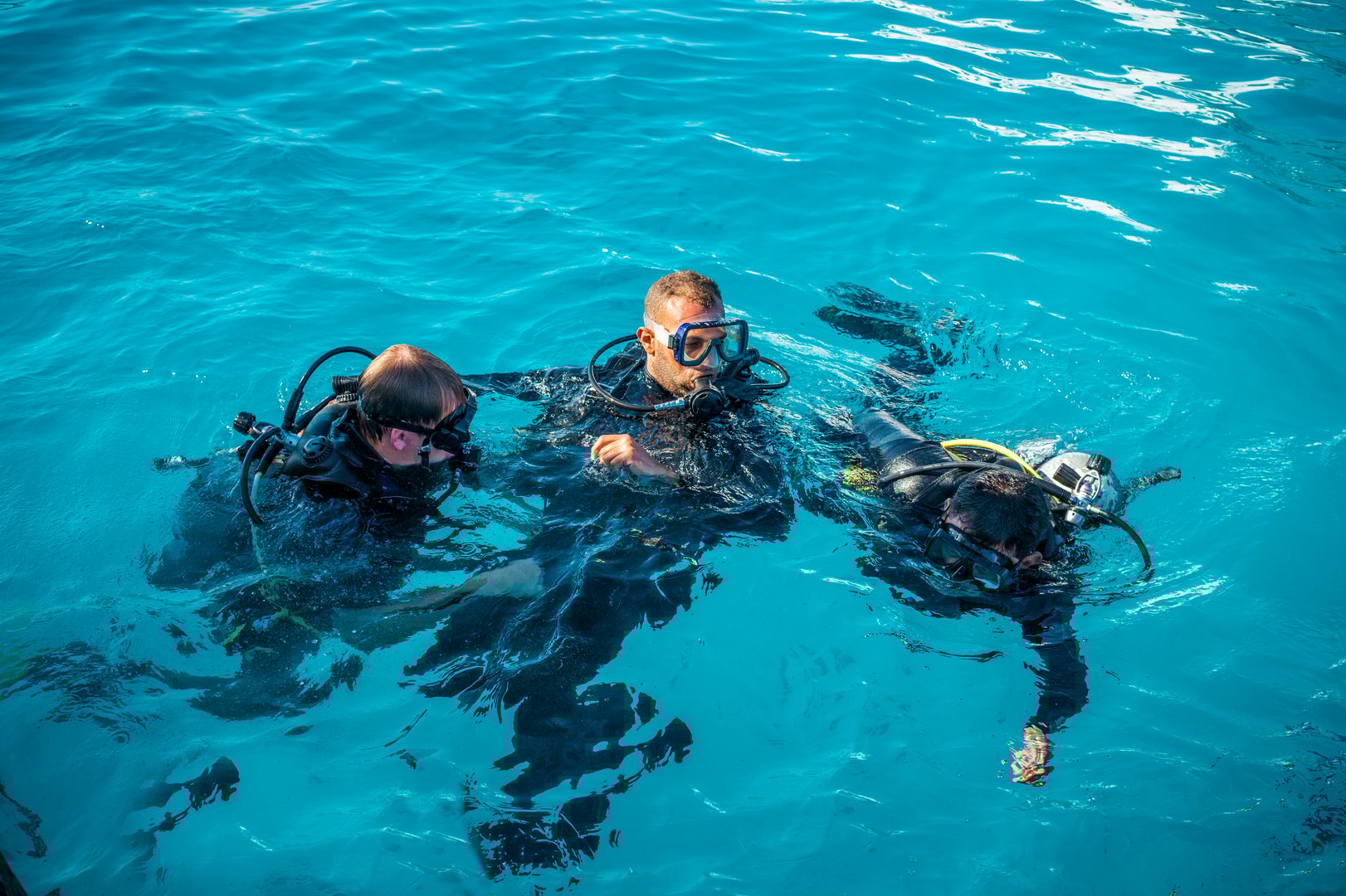 Professional commercial diver underwater with scuba gear
