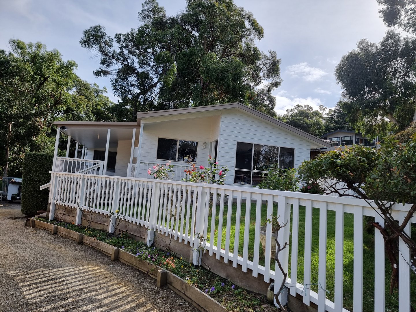 Coastal cottage completed exterior showing final painted results
