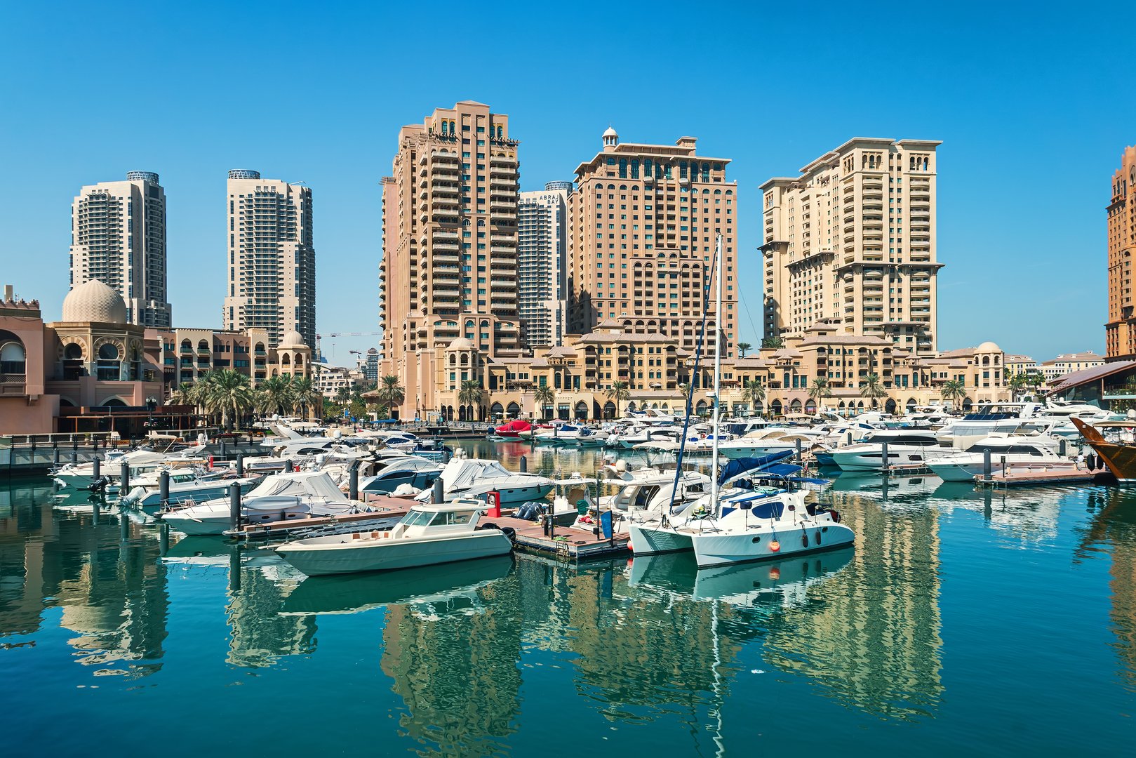 Doha, Qatar: The pearl Marina in Porto Arabia daylight view with Yachts in foreground