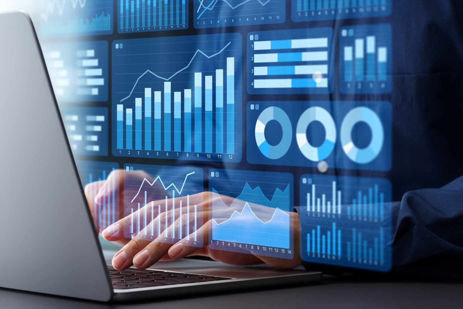 Business statistic data and sales data analytics dashboard. Graphs and charts of web marketing analysis. Analyst using laptop computer to analyze data.