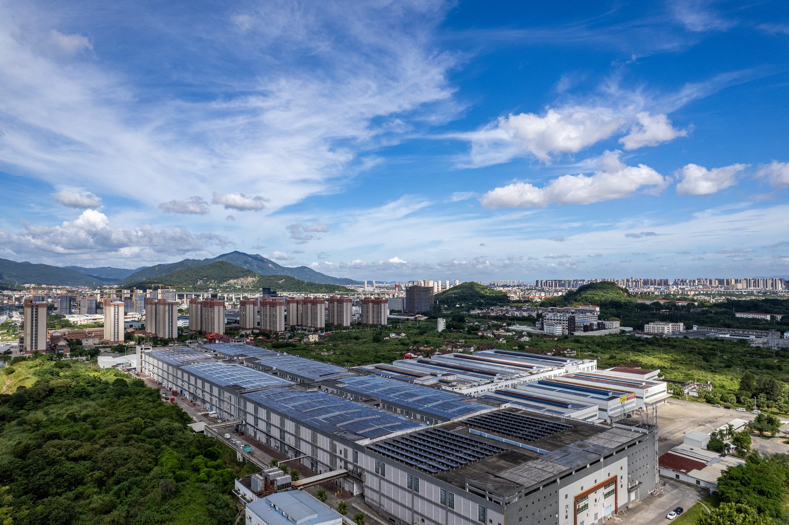 Overlooking the photovoltaic solar panels on the roof of an old factory