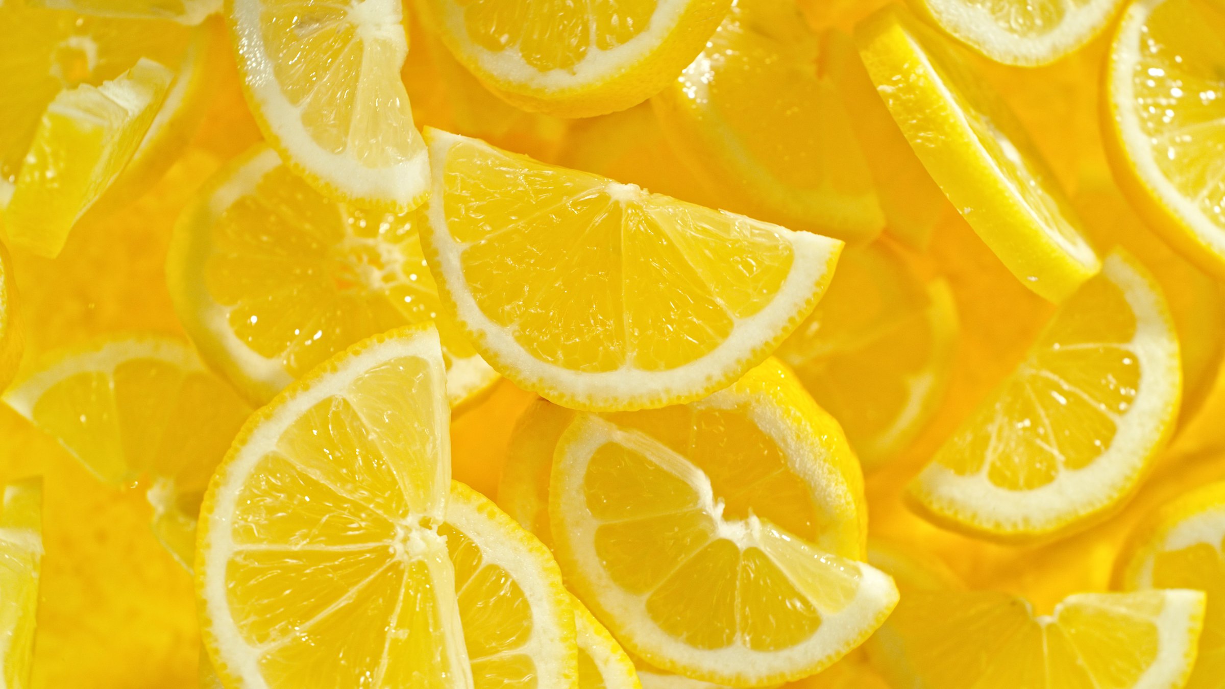 Top shot of lemon slices flying up in the air