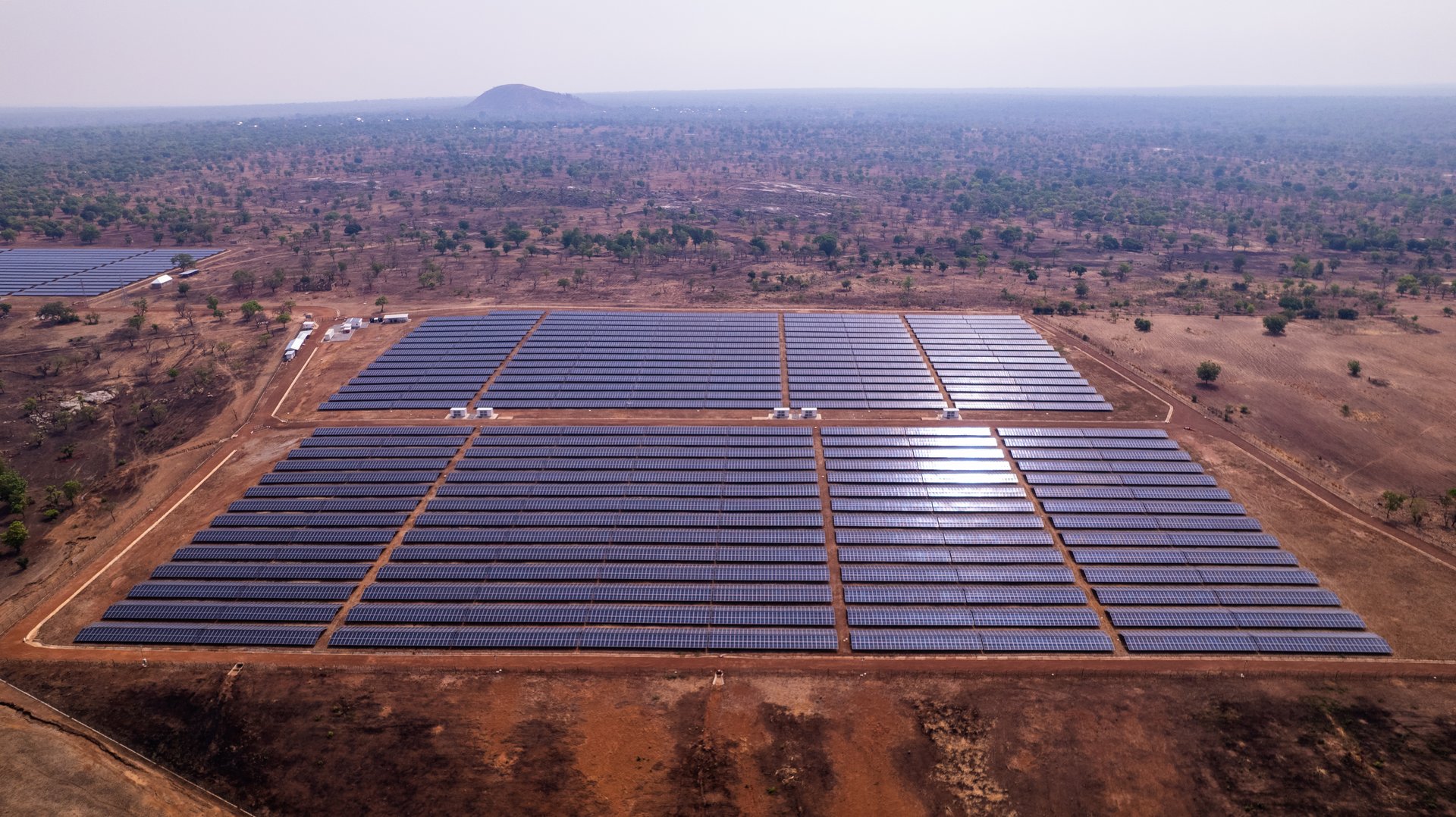 Renewable Energy, Drone Shot of African solar power plant in arid landscape in Ghana.