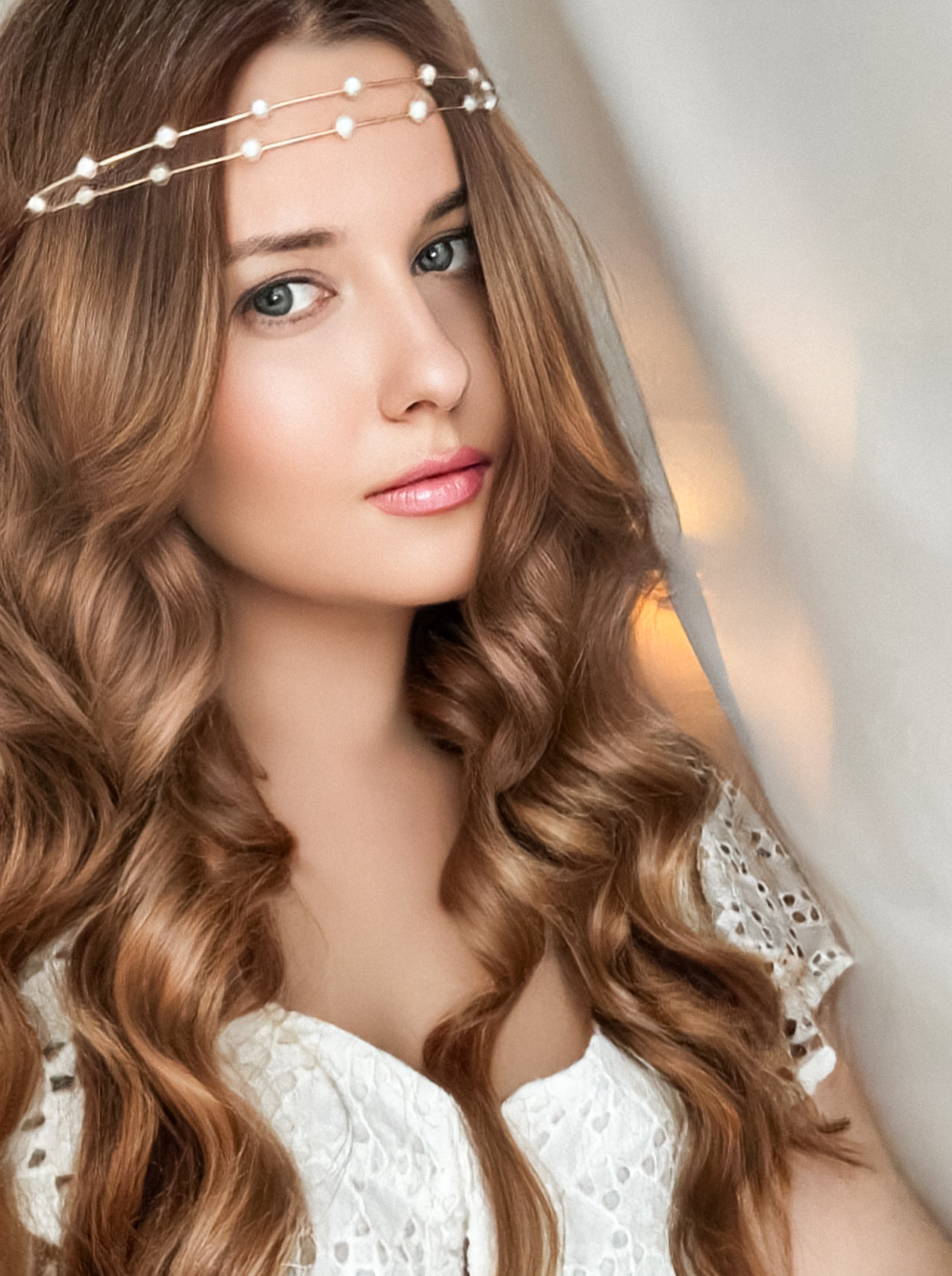 Beautiful bridal look, bride with long hair, wearing pearl tiara jewellery and beauty makeup, woman with curly hairstyle, face portrait for wedding and fashion style idea