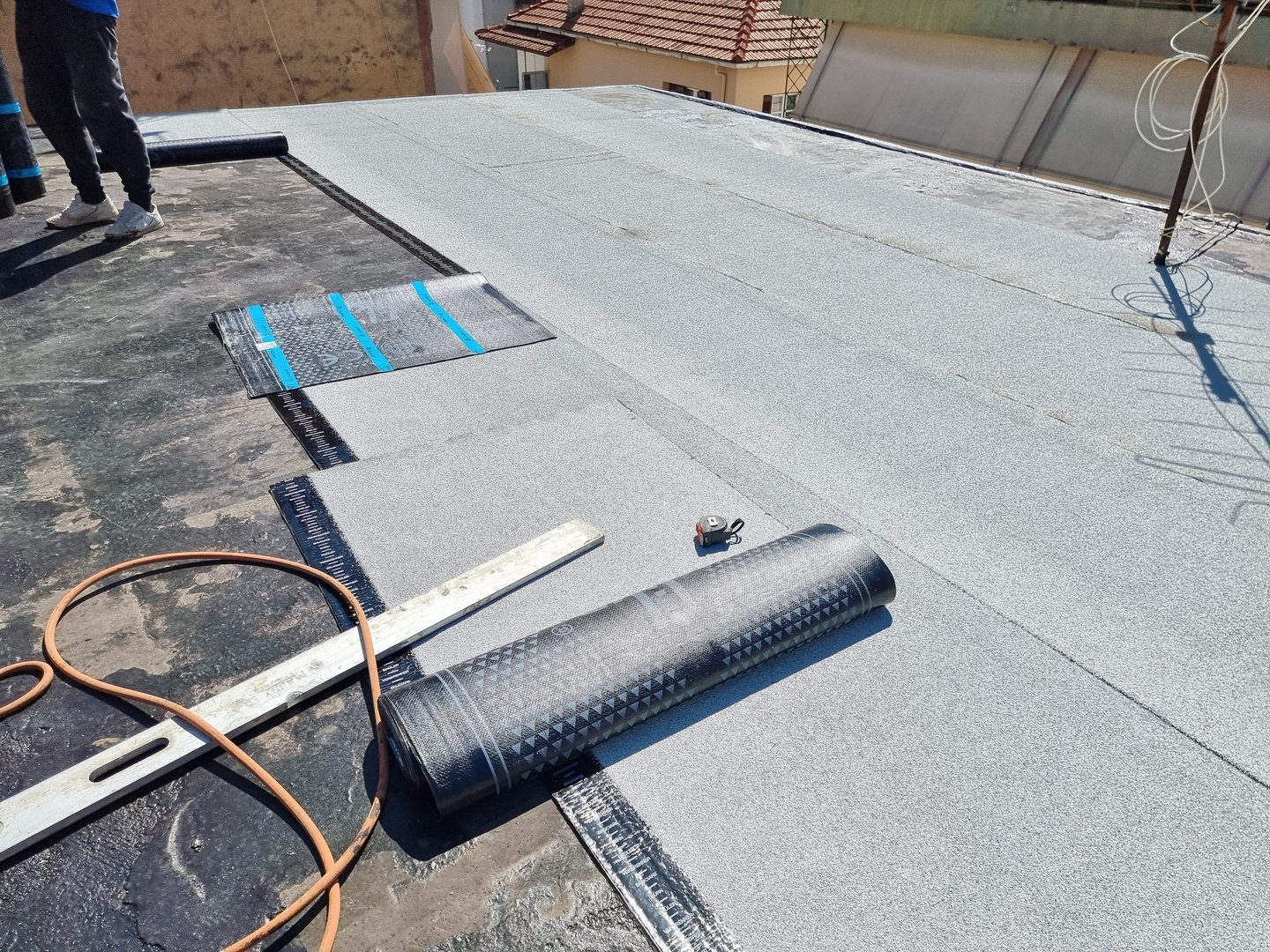 tarmac terrace insulation waterproof instalation worke working on the roof of a building maintenance