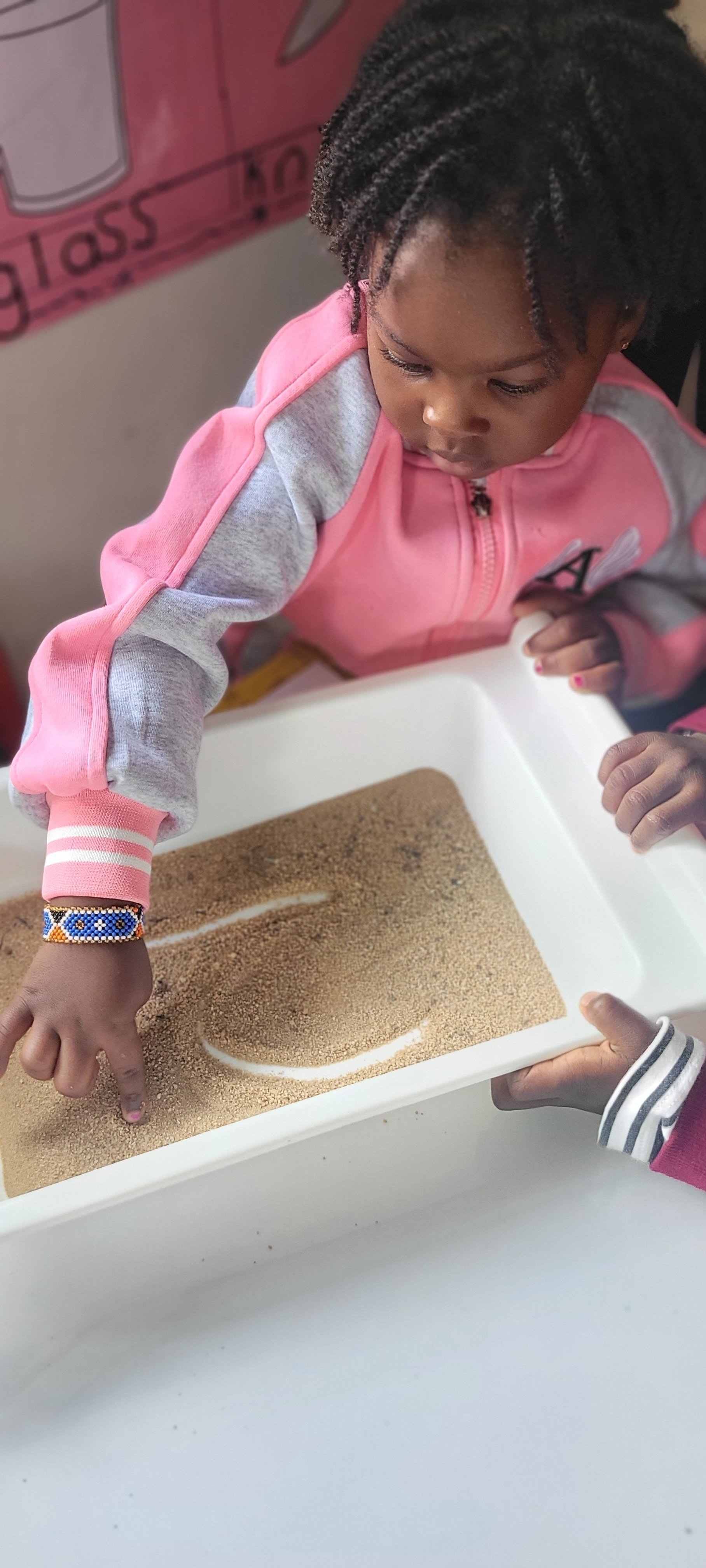 Children engaged in play-based learning with educational toys