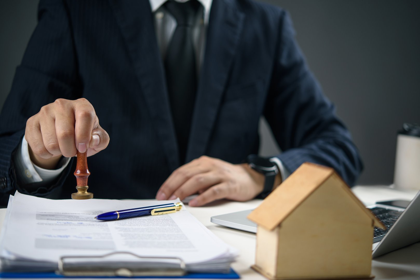 Notary signing agent completing mortgage documents