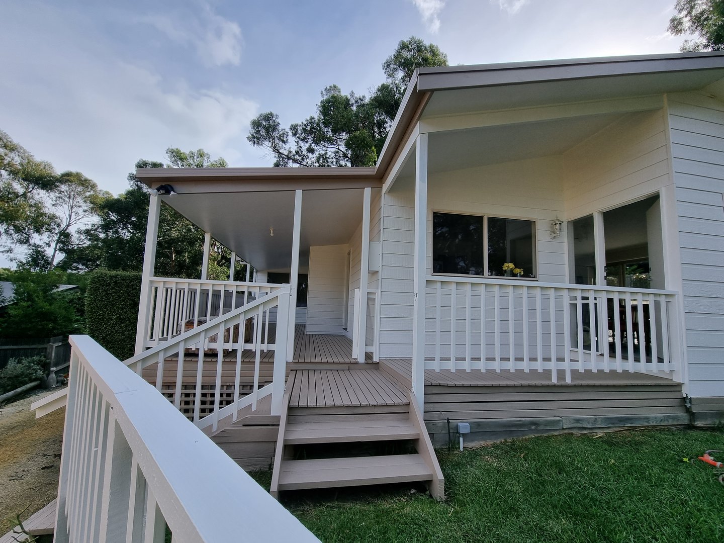 Coastal cottage after painting - completed exterior transformation