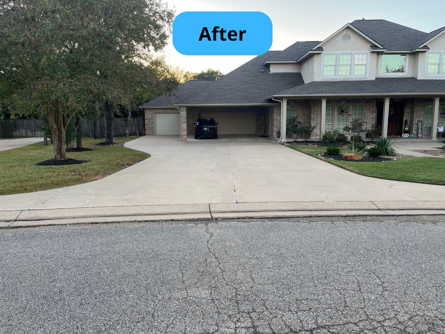 Driveway after pressure washing showing pristine clean results
