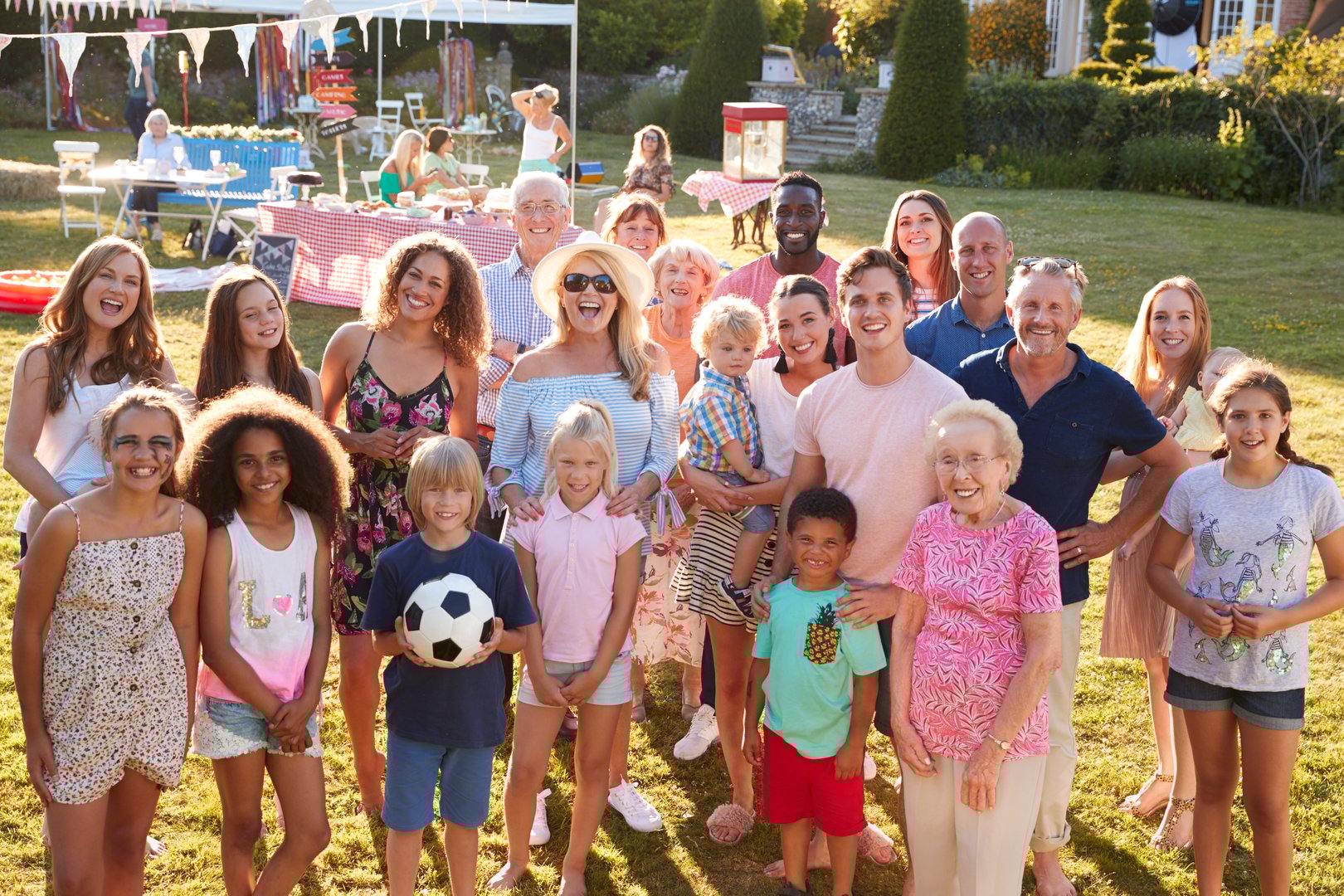 Group Portrait Of People Attending Summer Garden Fete