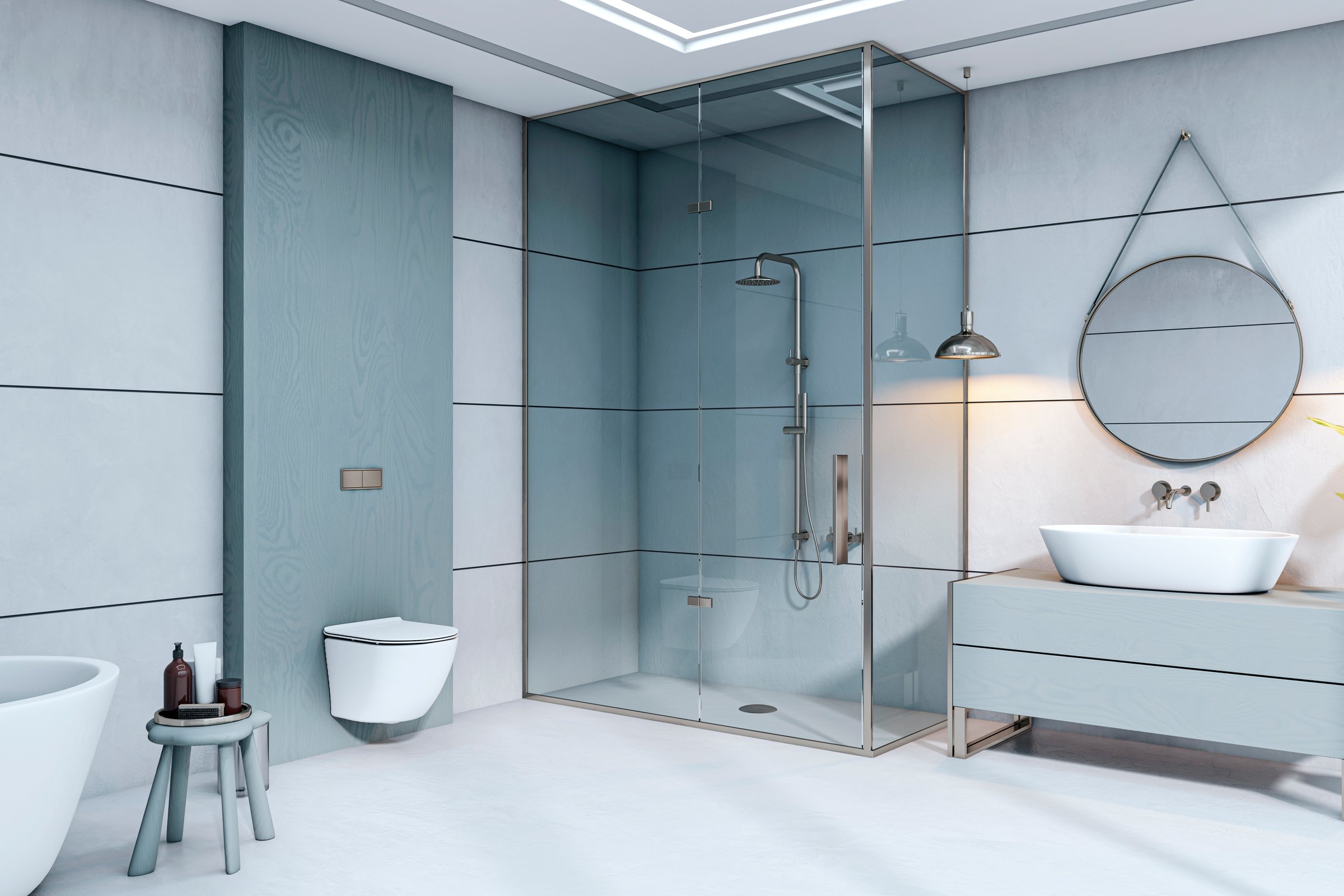 Stylish modern bathroom interior with glass shower, minimalist furniture, and round mirror on a light gray wall background. 3D Rendering