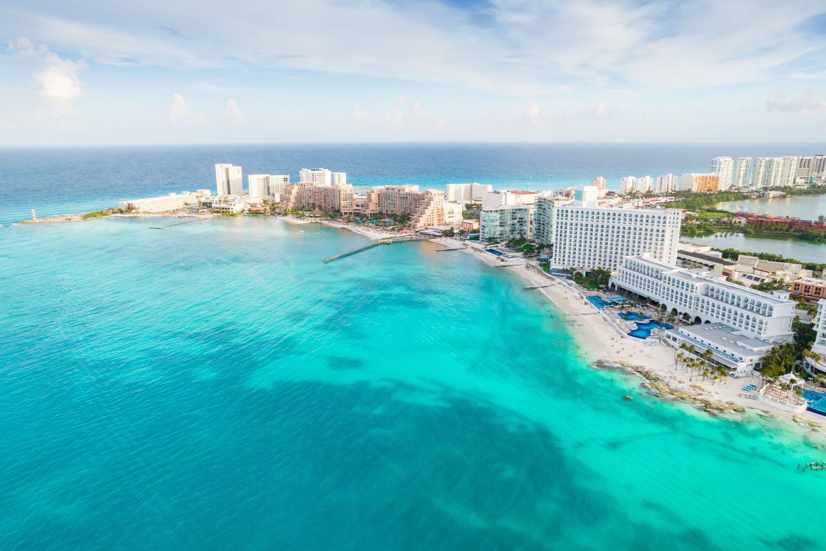 Aerial panoramic view of Cancun city hotel zone in Mexico. Caribbean coast landscape of Mexican resort with beach Playa Caracol and Kukulcan road. Riviera Maya in Quintana roo region on Yucatan Peninsula
