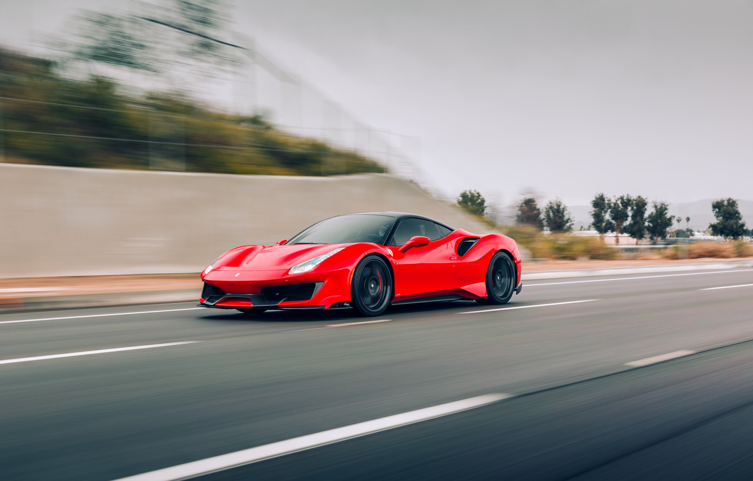Seattle, WA, USA
5/22/2022
Ferrari 488 Pista in red driving on the highway with white lines