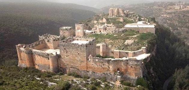 Saladin Castle (Qal'at Salah al-Din) fortress perched on mountain ridge in Syria