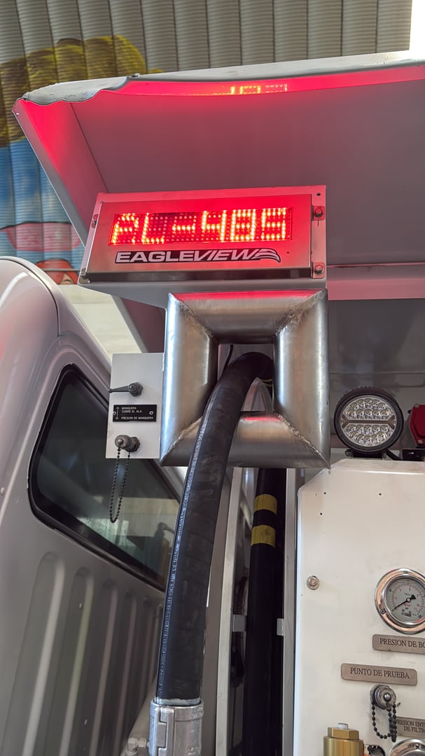 Fuel dispenser with LED display reading 43.498, attached to a truck. The label Eagleview is visible.