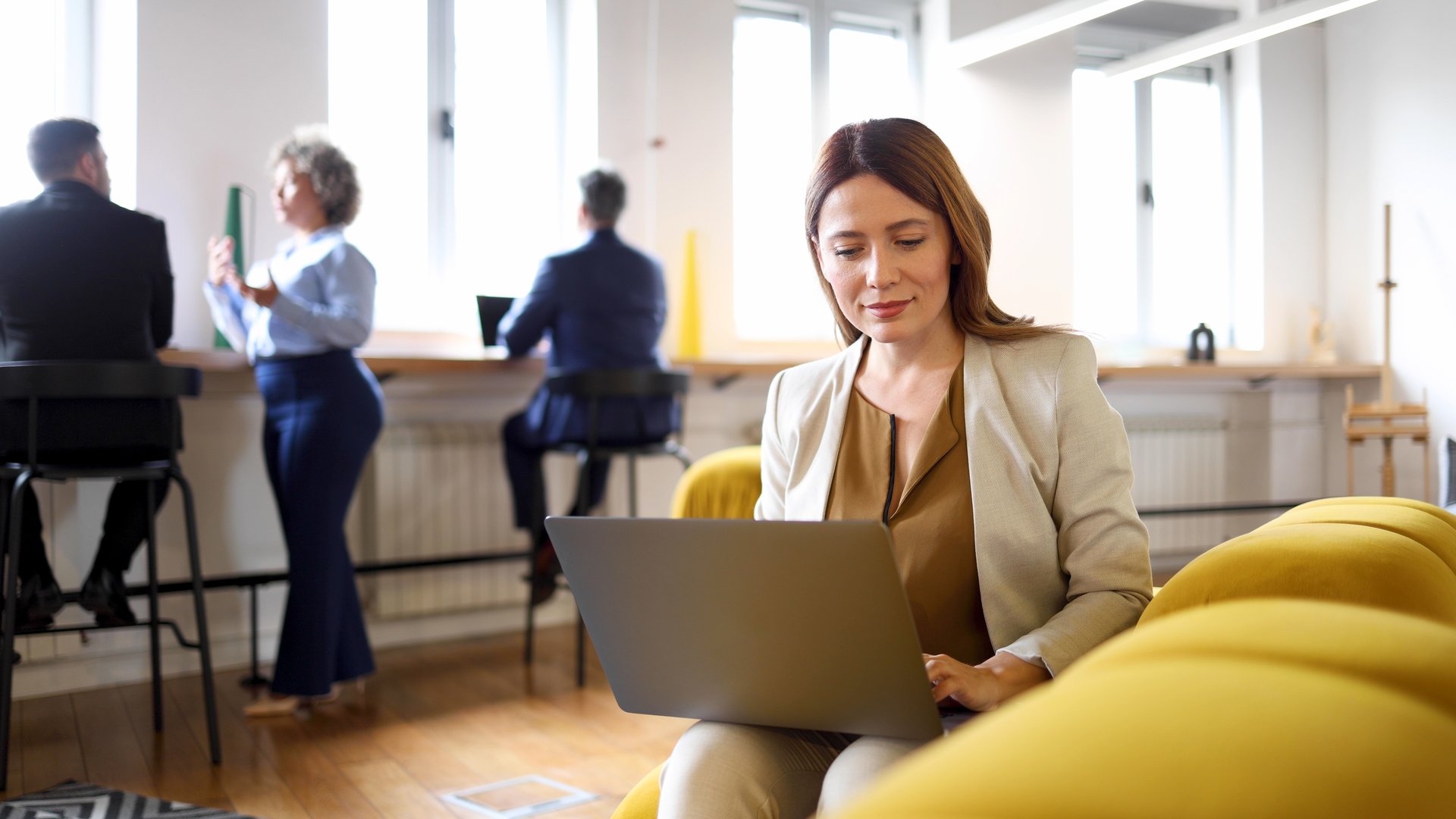Businesswoman stretching after a long online business meeting