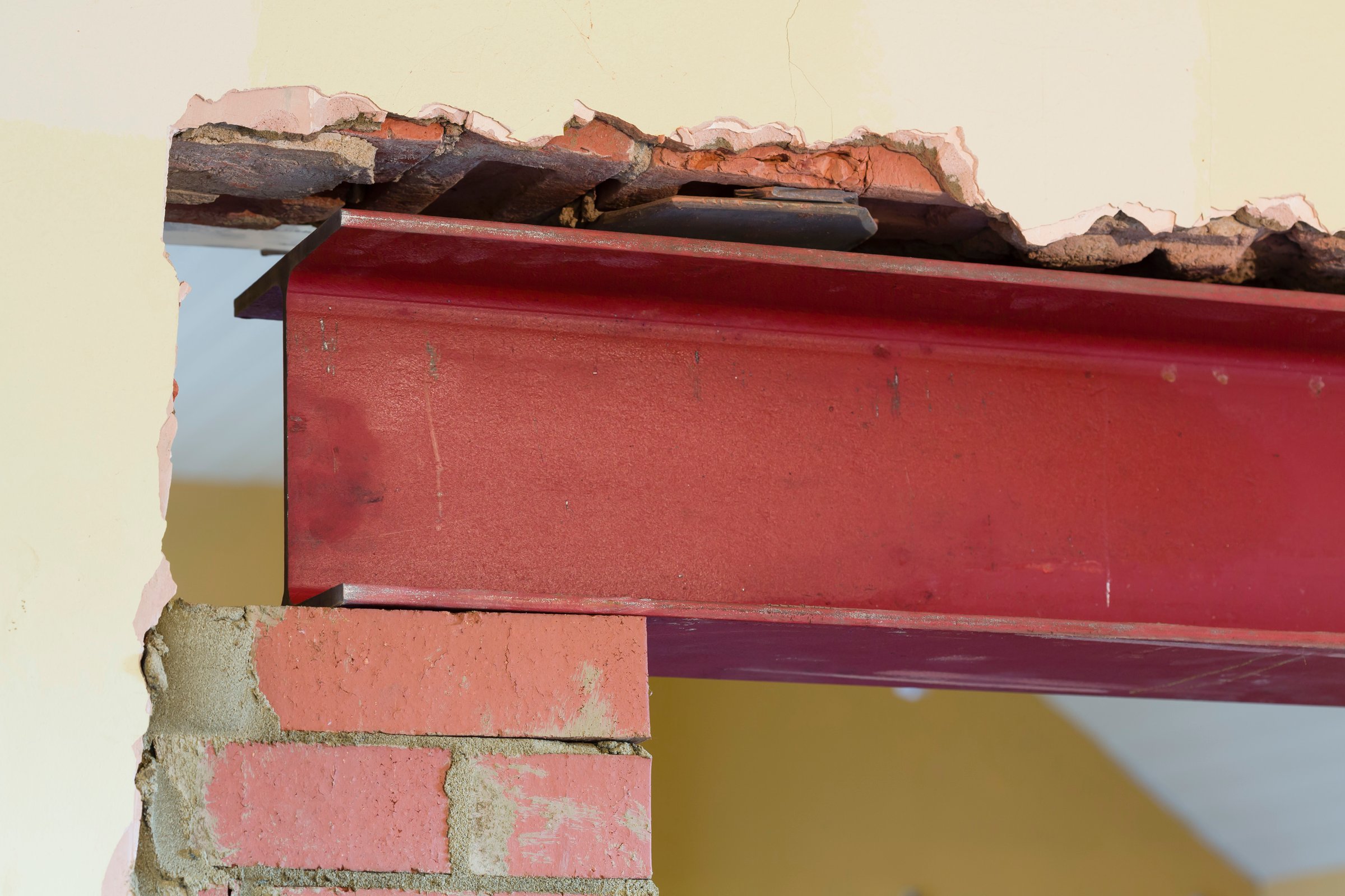 New wall opening supported by RSJ universal steel beam, part of building work in a UK house renovation