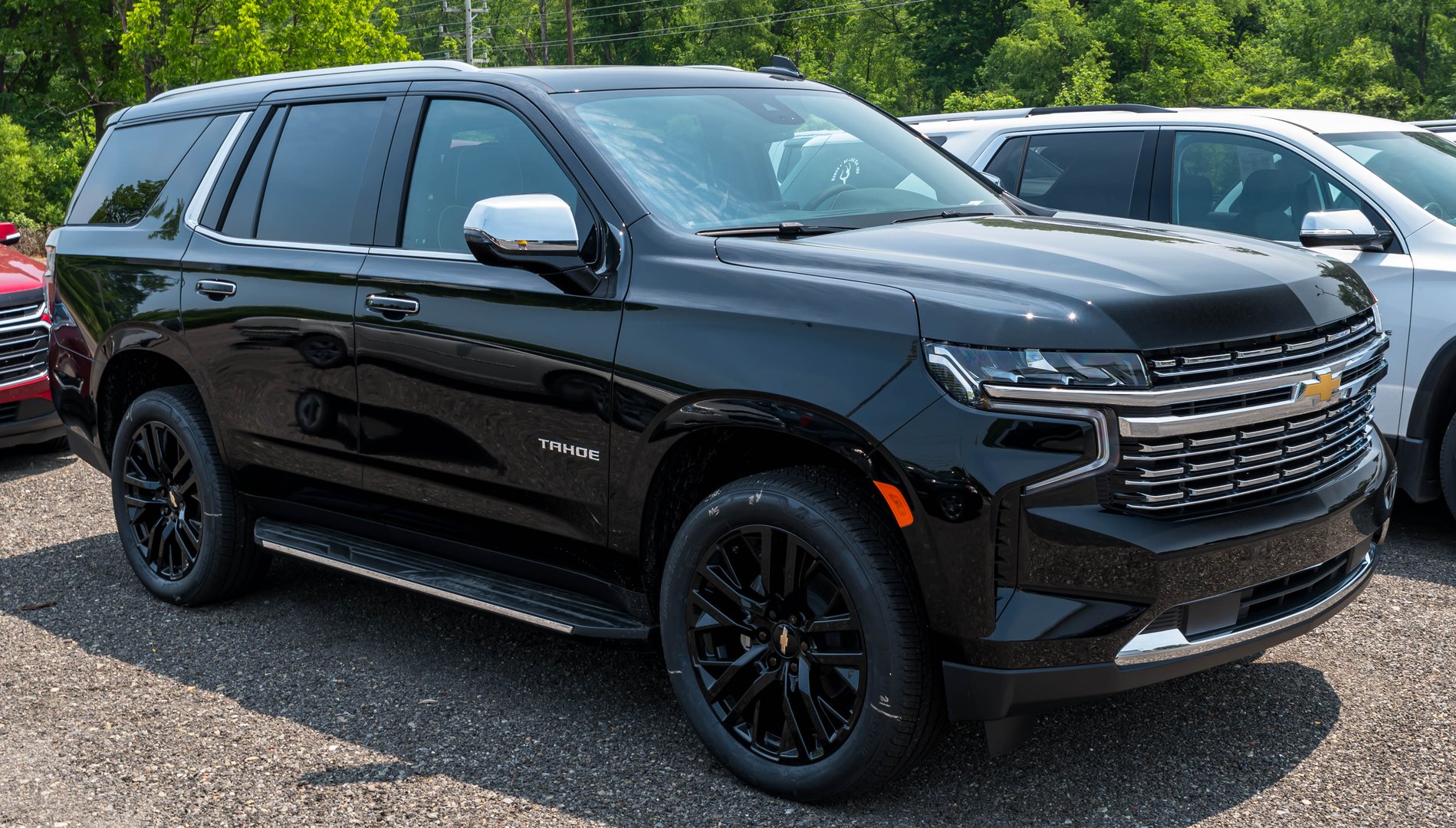 Starbrick, Pennsylvania, USA June 18, 2023 A used, black Chevrolet Tahoe SUV for sale at a dealership on a sunny spring day
