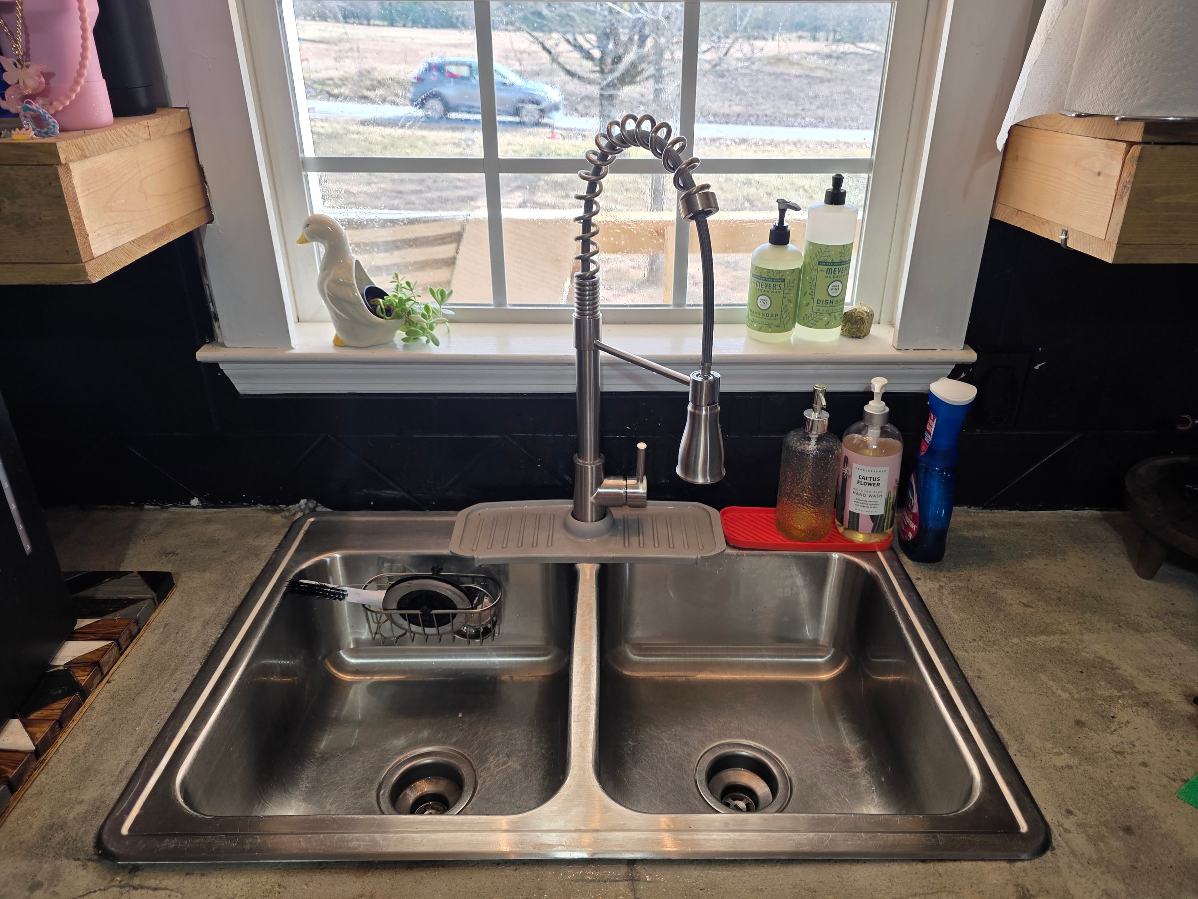 Kitchen sink after cleaning - showing sparkling clean sink