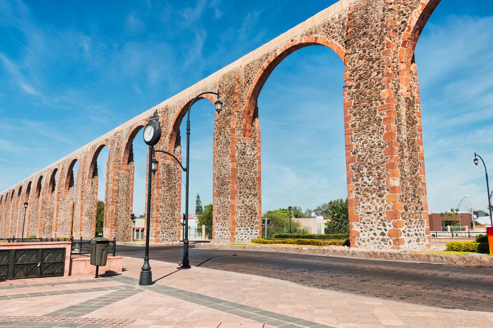 Stone orange aqueduct at Queretaro downtown, plaza, Mexico