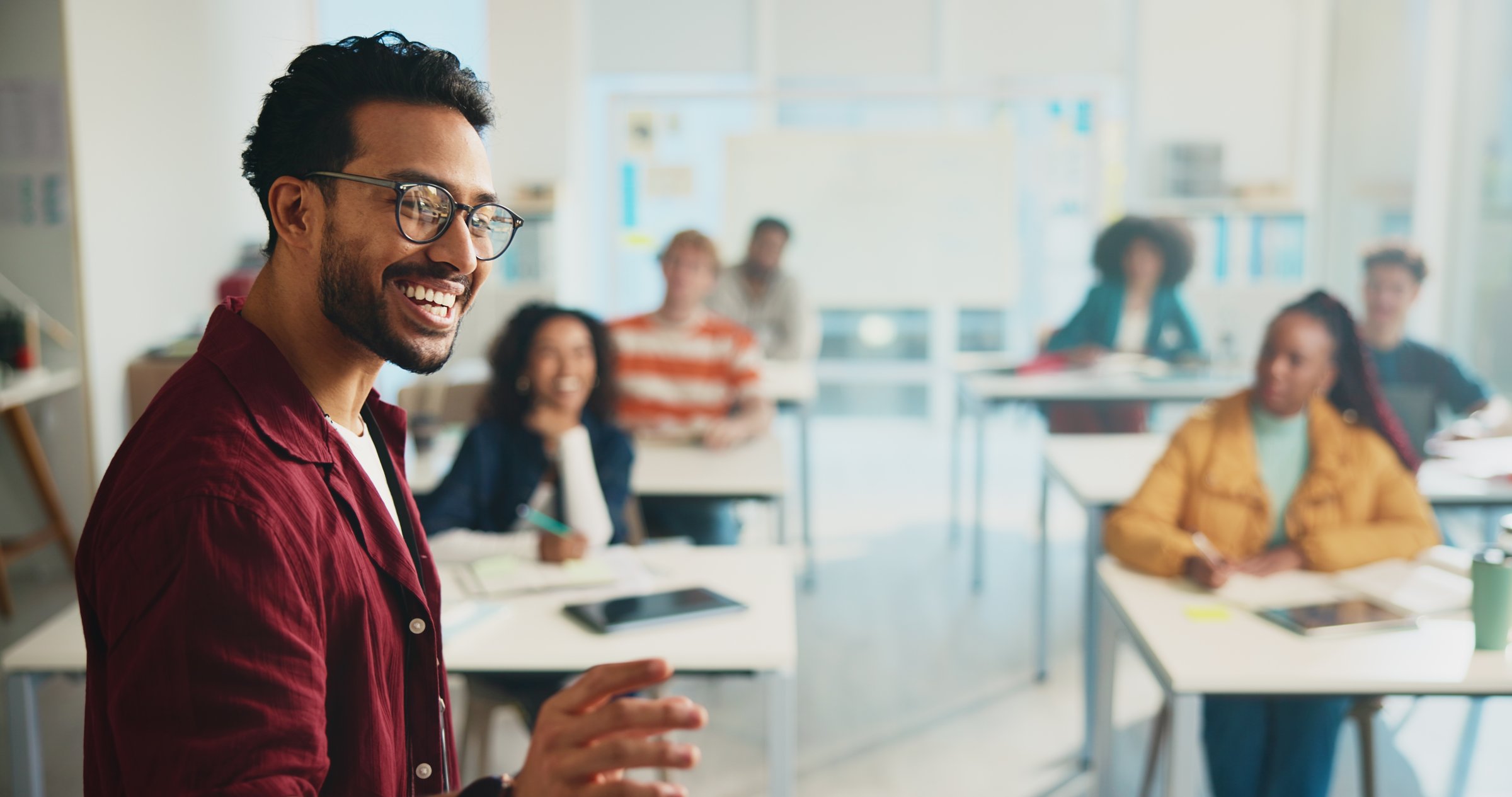 University, discussion and education with students, man and learning with feedback. People, group and teacher with development, college and presentation with knowledge, exam schedule or communication