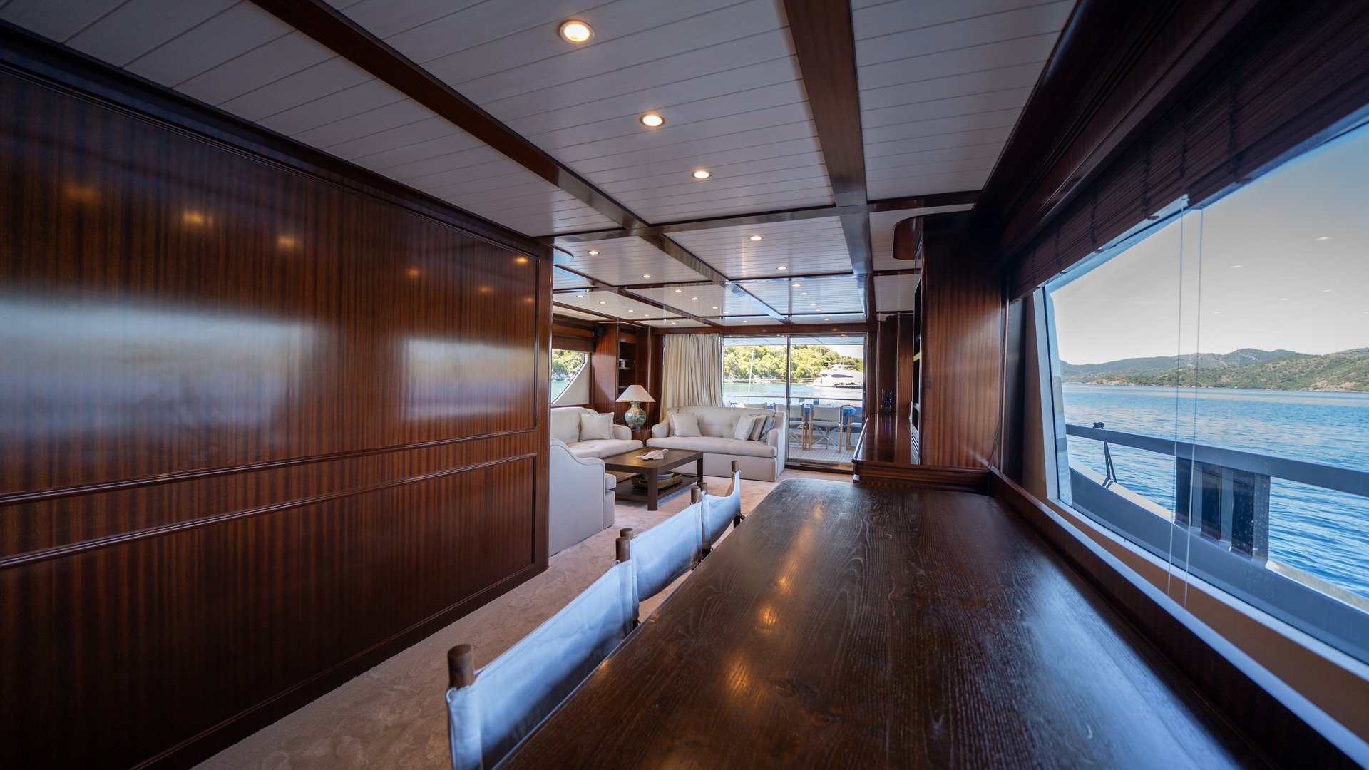 A modern luxury yacht interior featuring sleek furniture, soft lighting, and premium finishes. The stylish space reflects elegance, comfort, and exclusive marine lifestyle.