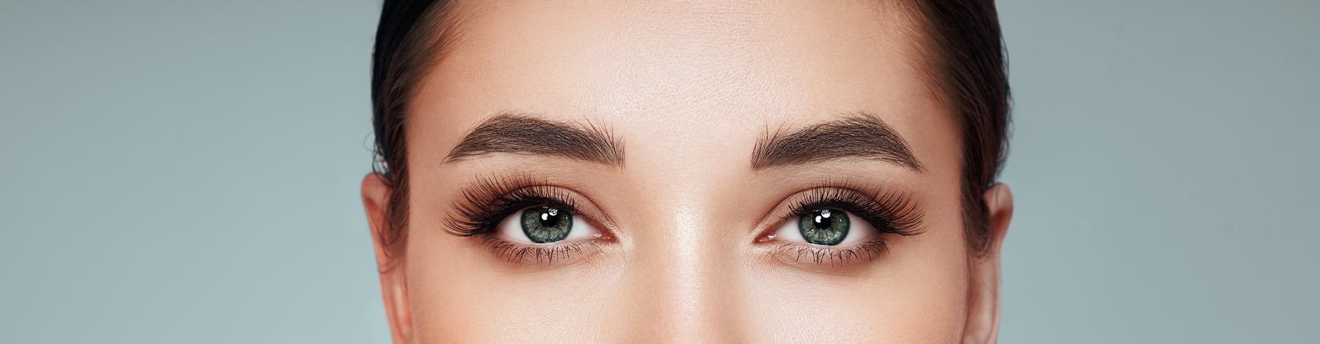 Female eye with extreme long false eyelashes