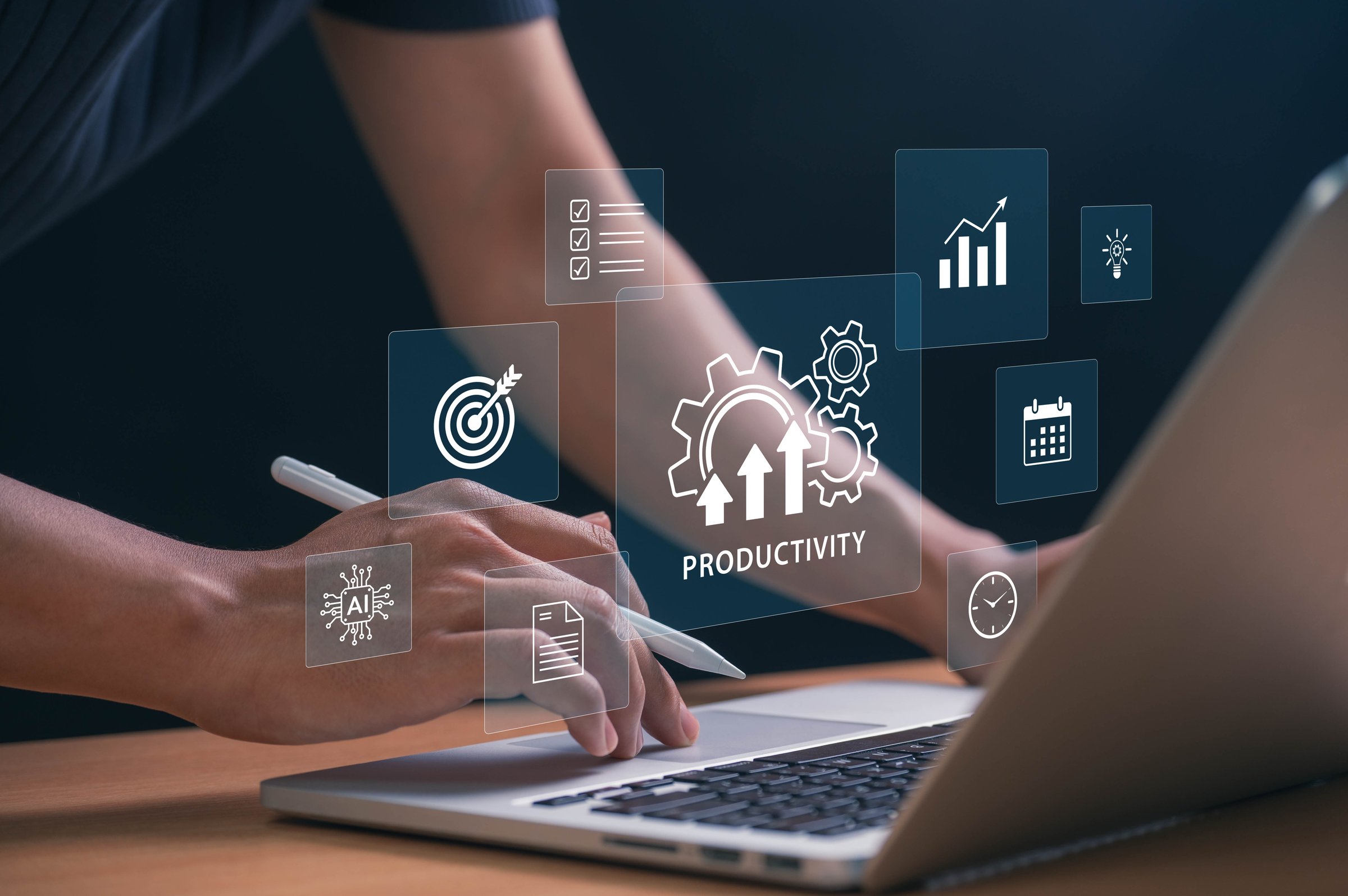 Boosting Productivity with AI and Automation Tools. hands using laptop with tech icons showing goals, schedules, and innovation, symbolizing data driven success and efficient workflow strategies.