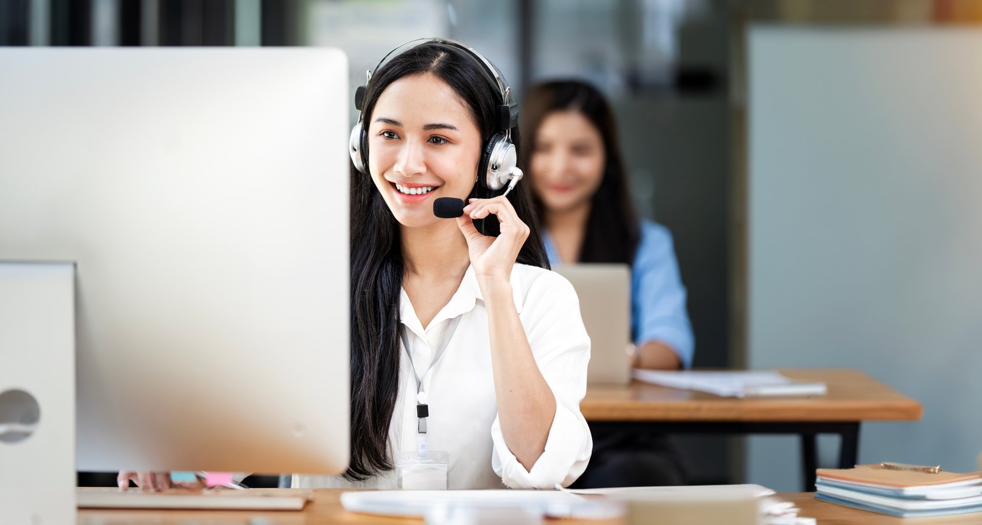 Smiling customer support operator at work