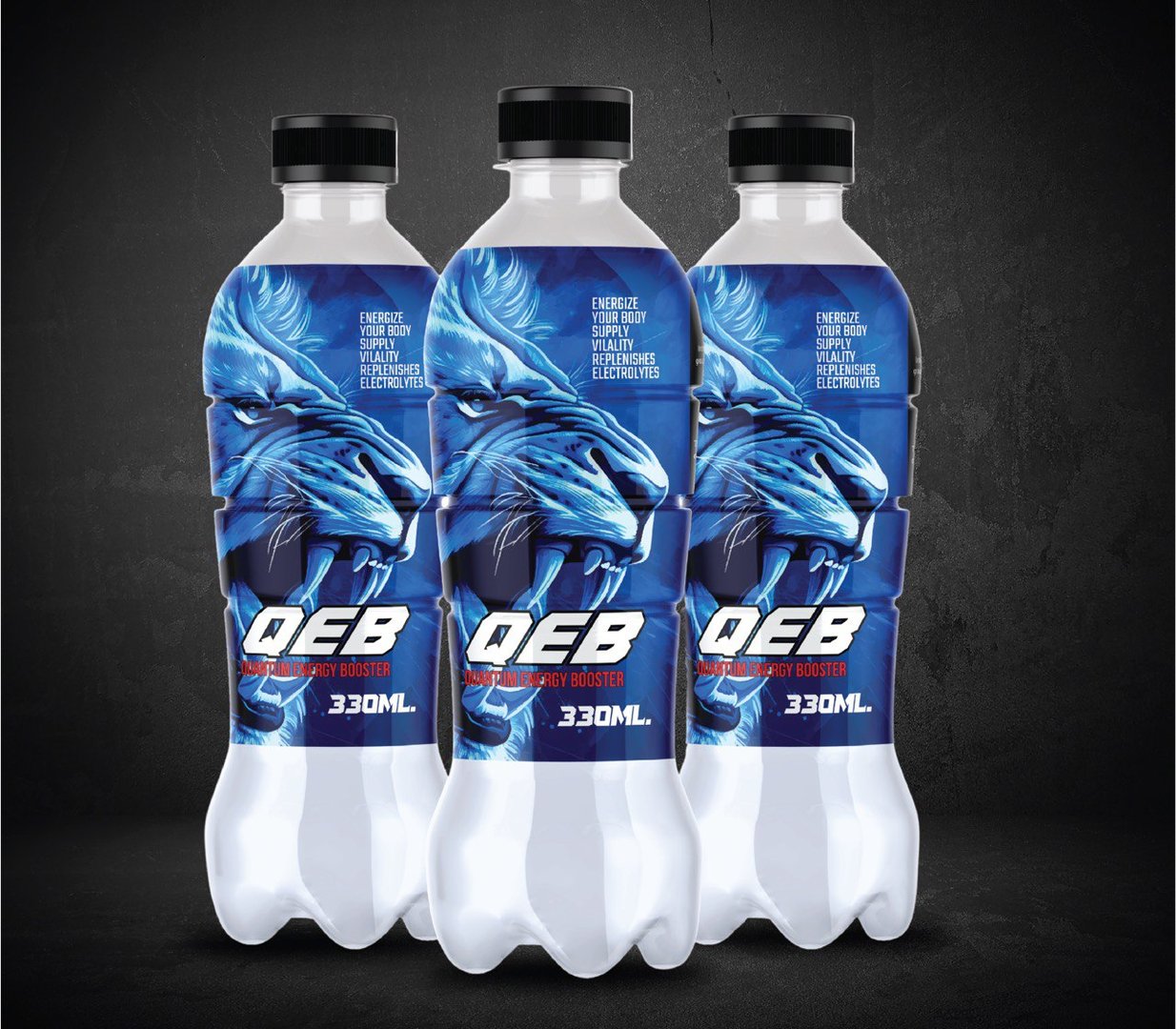 Three 330ml bottles of QEB energy drink with a blue lion design and bold text on the label against a dark background.