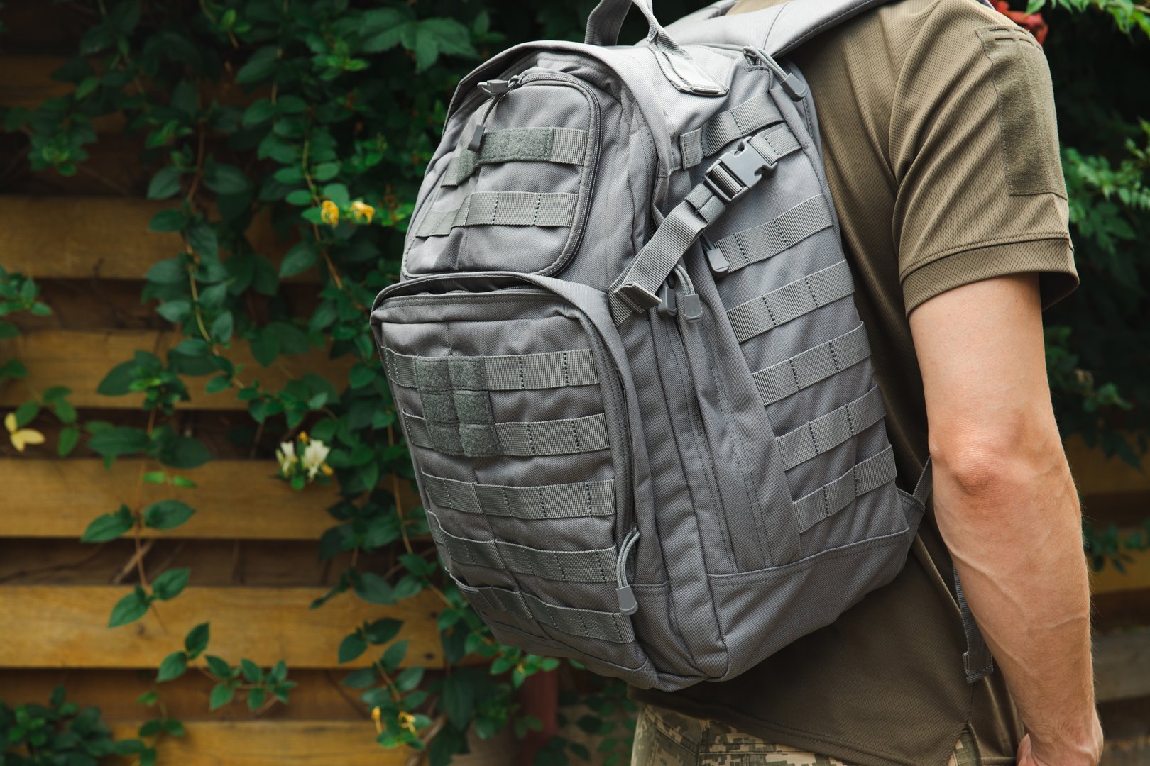 Military tactical backpack.Military backpack.Tactical hiking backpack on a military man. Place for text. Copy space. Military concept. No war.