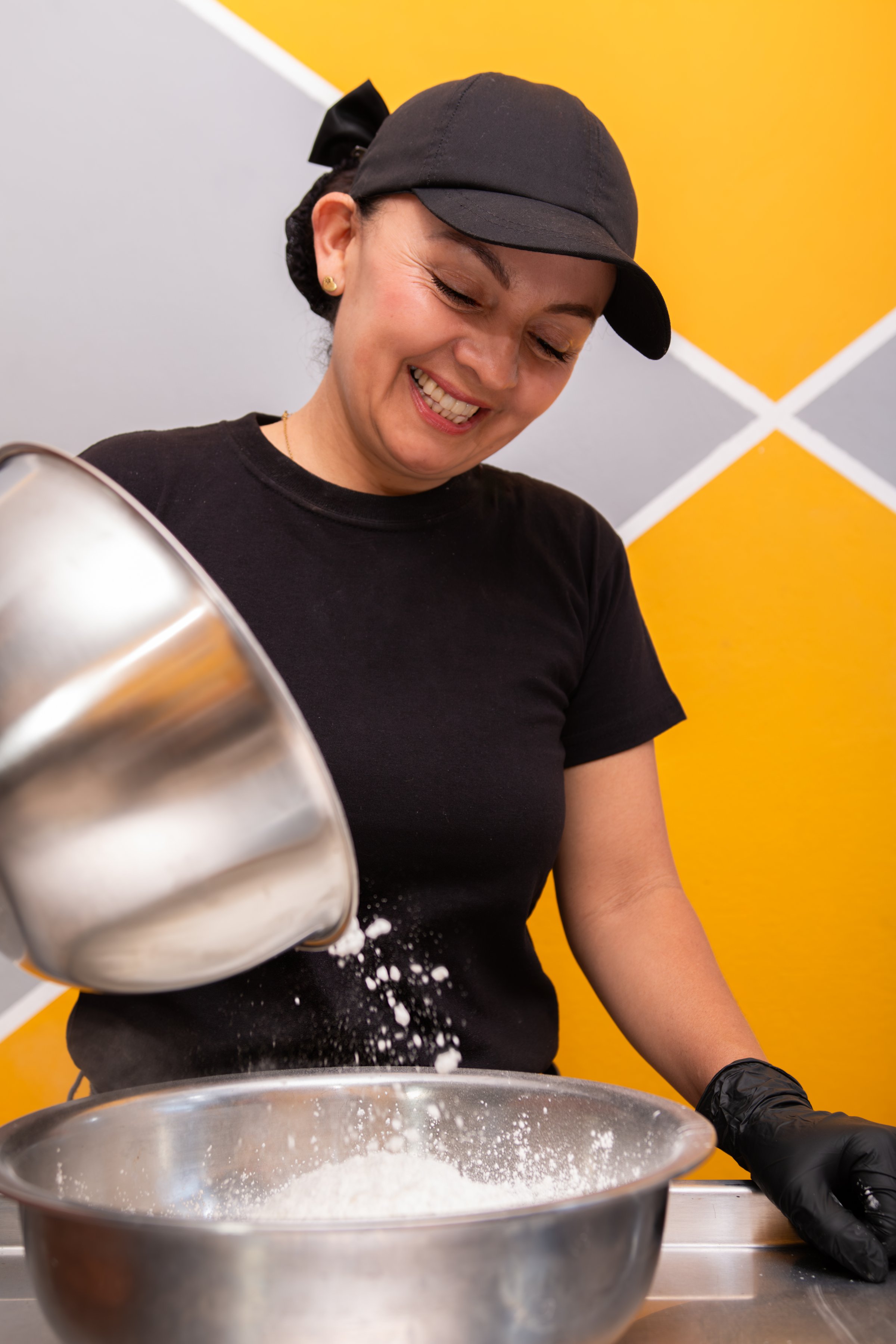 Young Woman Mixing Flour and Ingredients for a Delicious Bakery Recipe